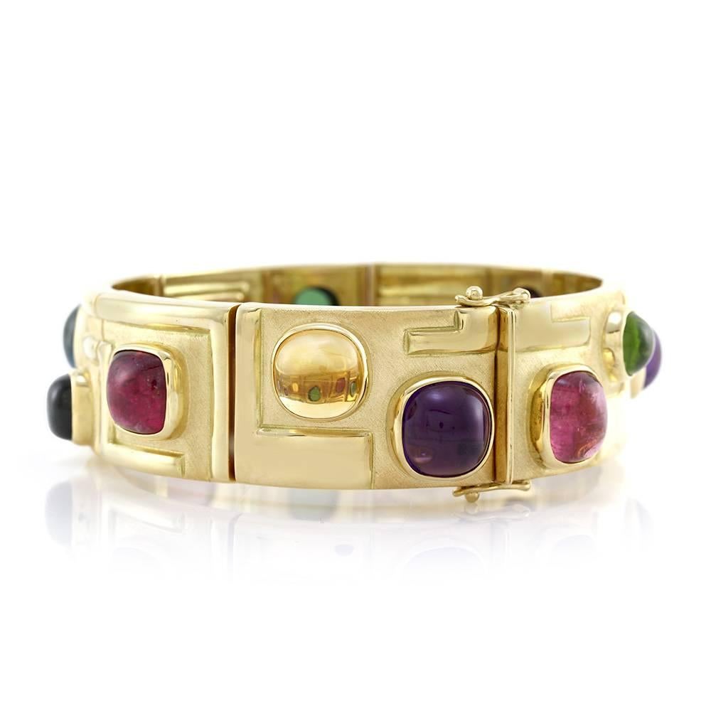Bruno Guidi modernist multi-color tourmaline and quartz cabochon link bracelet set in 18K yellow gold. There are four cushion pink tourmaline cabochons (25.00ctw), two cushion and one round green tourmaline cabochons (11.00ctw), and one cushion blue