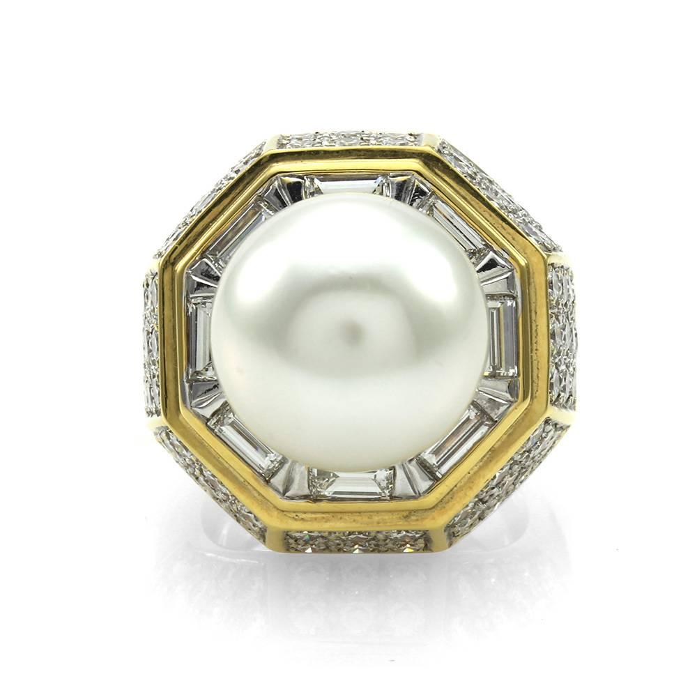 South Sea pearl ring with pavé diamonds and baguette diamonds in high polished 18K yellow gold. There are one round, white South Sea pearl (14.5mm x 14.0mm), eight straight baguette cut diamonds (1.85ctw) and eighty round brilliant cut diamonds