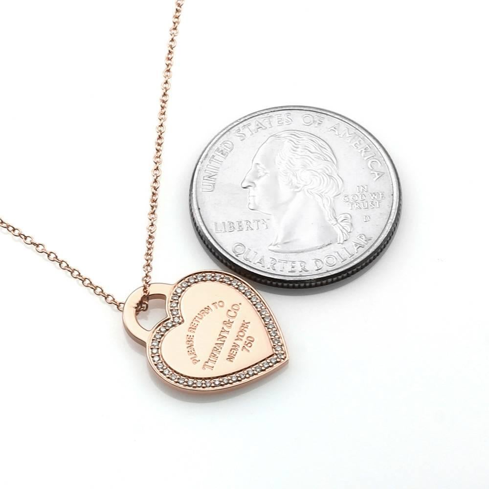 Tiffany & Co., Return to Tiffany (New York) micro-pavé diamond heart tag necklace set in 18K rose gold. There are forty-four round brilliant cut diamonds (0.15ctw) with a color of G-H and a clarity of VS. The diamonds are bead set. The pendant