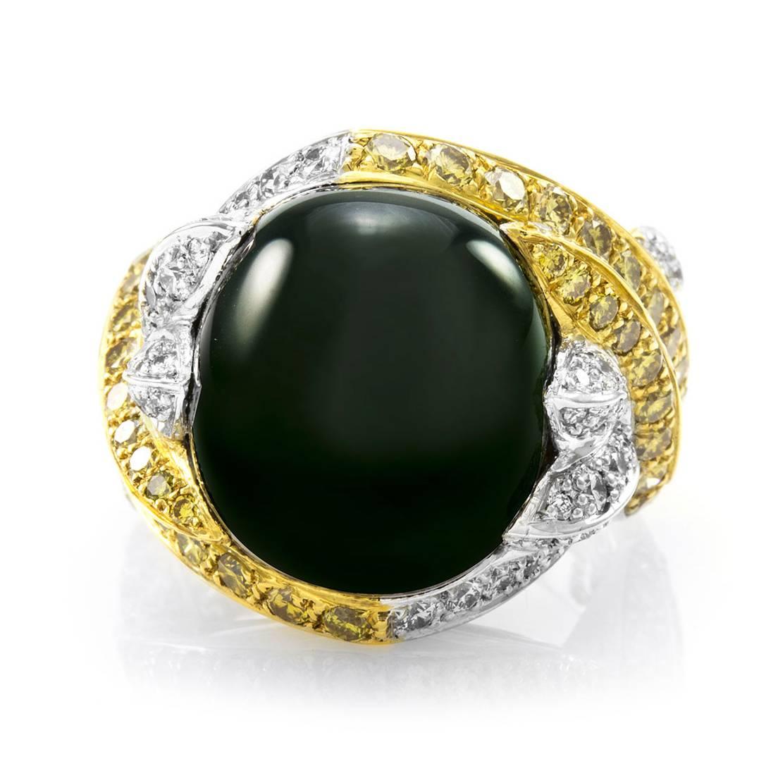 Green tourmaline bypass ring with yellow and white pavé diamonds set in 18K gold. There are one oval tourmaline cabochon (15.02ct), sixty-six yellow round brilliant cut diamonds (1.70ctw), and sixty-nine white round brilliant cut diamonds (0.95ctw)