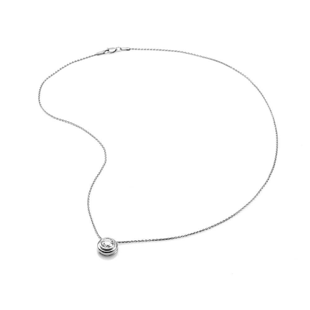 Diamond solitaire necklace in 14K white gold. There is one transitional cut diamond (1.00ct) with a color of I and a clarity of VS2. The diamond is bezel set in high polish white gold. The pendant has a 10.0mm diameter and comes on a 1.1mm wheat