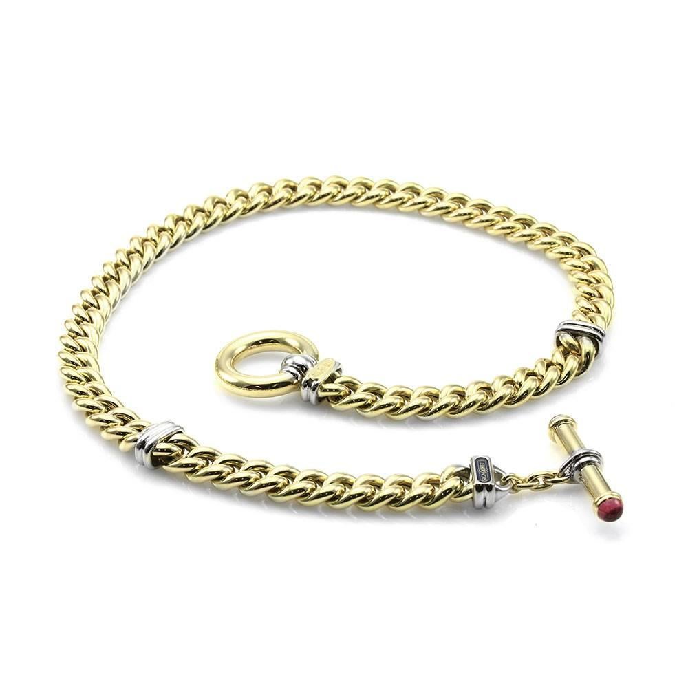 Signoretti curb link necklace with tourmaline accents in 18K yellow gold. There are two round tourmaline cabochons (5.7mm) that are bezel set on the toggle clasp. This necklace is 9.8mmm wide and 17.5 inches long. The total weight of this necklace