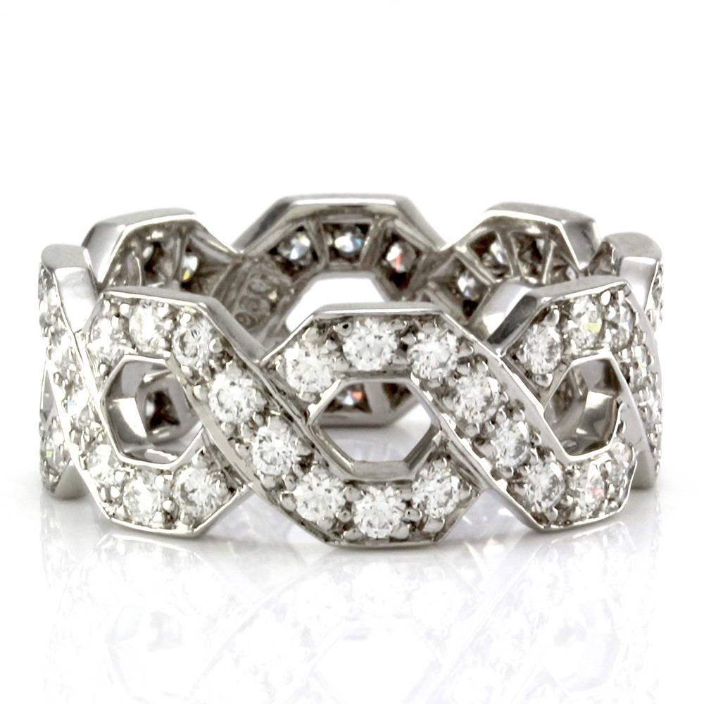 Tiffany & Co. pavé diamond hexagon pattern eternity band ring set in platinum. There are sixty-four round brilliant cut diamonds (1.28ctw) with a color of D-F and a clarity of VVS-VS. The diamonds are bead set. This ring is 8.0mm wide, with a
