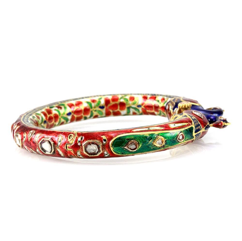 Hindu rose cut diamond and enamel peacock wedding bangle set in 20K yellow gold. There are twenty-one rose cut diamonds (1.75ctw). There is red, blue, white and green enamel. This hinged bangle is secured by a locking screw closure. This bangle is