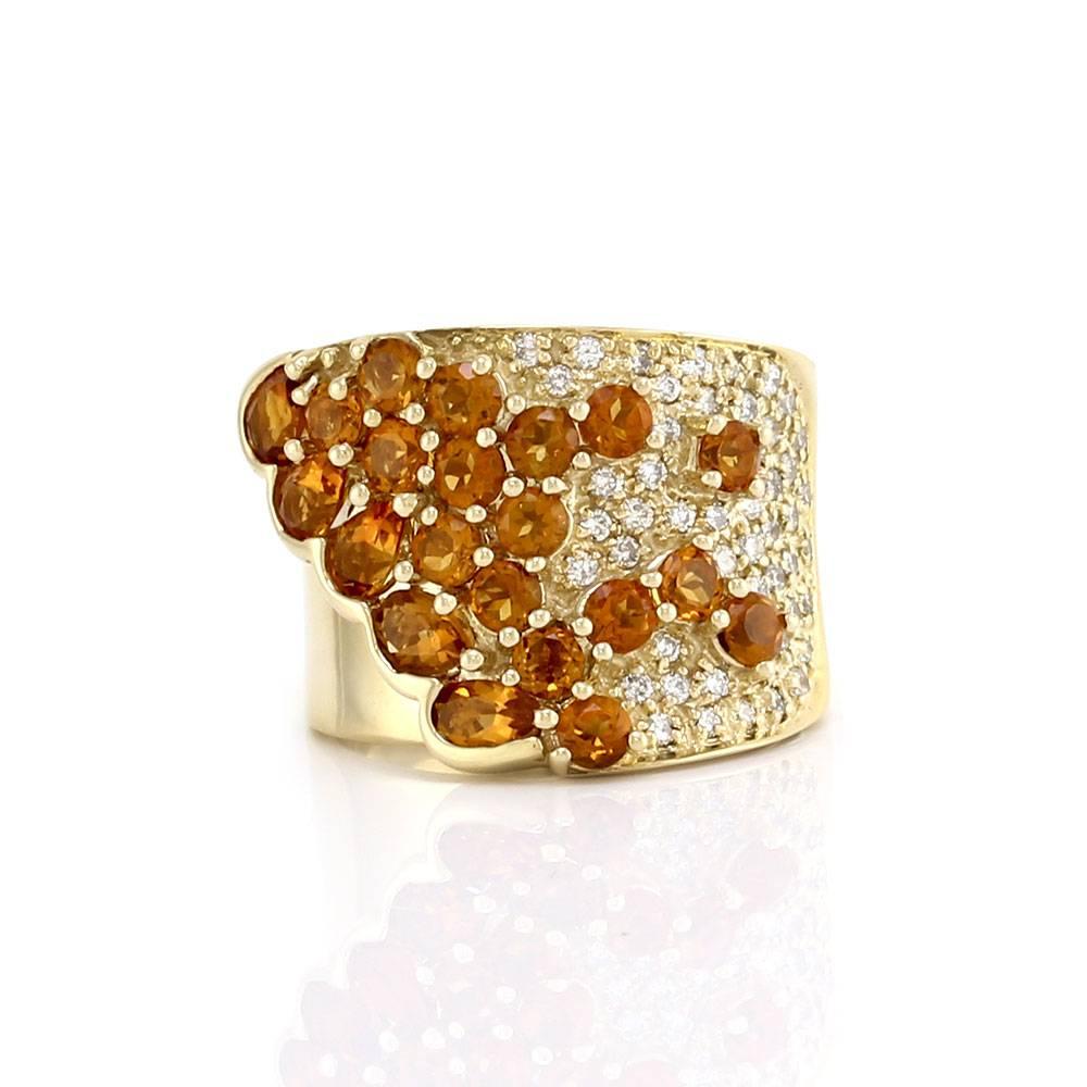 Sonia B. citrine and pavé diamond cluster ring, cigar band set in 14K yellow gold. There are twenty-one round and pear faceted citrines (2.25ctw) and forty-seven round brilliant cut diamonds (0.47ctw) with a color of H-I and a clarity of VS-SI. The