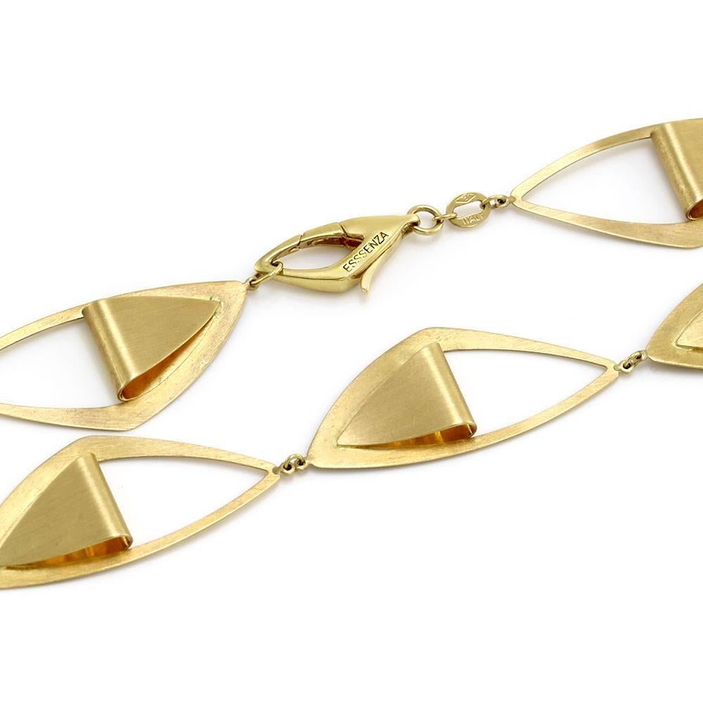 Triangular modernist link necklace in satin finish 18K yellow gold. This necklace is 16.2mm wide, complete with lobster clasp. The total weight of this necklace is 20.4g/ 13.1dwt. *This necklace has matching earrings (E10095) available for