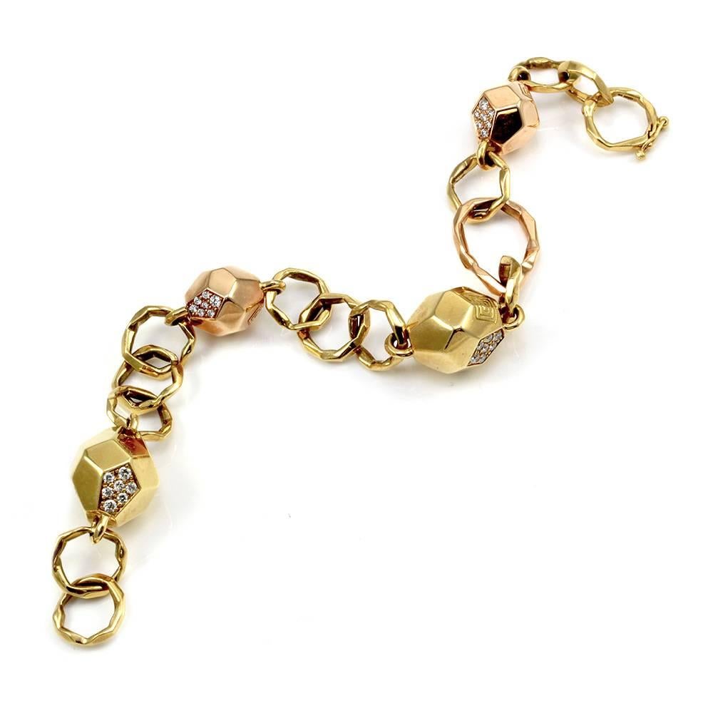 Mimi So Switch Diamond Rock bracelet with pavé diamonds in 18K yellow and rose gold. There are fifty-six round brilliant cut diamonds (0.96ctw) with a color of F-G and a clarity of VS. This bracelet is 14.2mm wide and 7.75 inches long with a snap