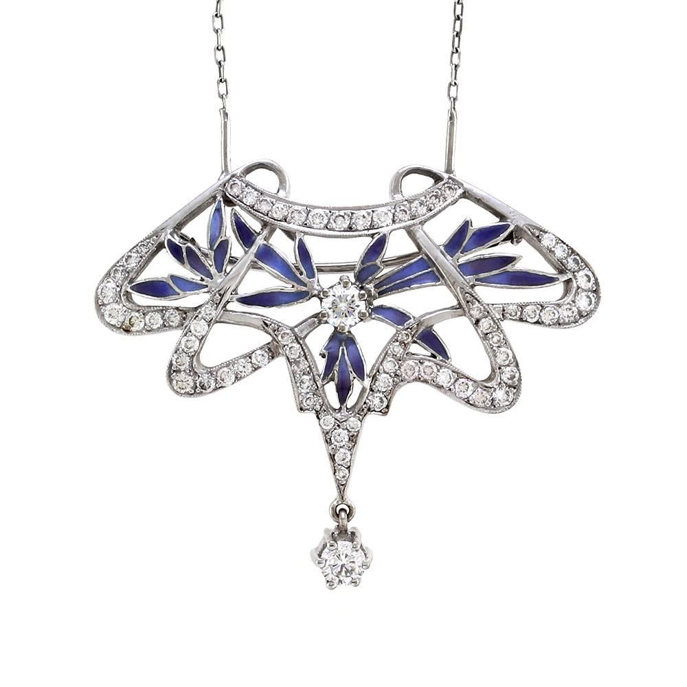 Nouveau 1910 Arctic Collection Ensueno diamond and blue enamel brooch/pendant in 18K white gold. There are sixty-seven round brilliant cut diamonds (1.91ctw) with a color of G-H and a clarity of VS-SI. The diamonds are bead and prong set. This