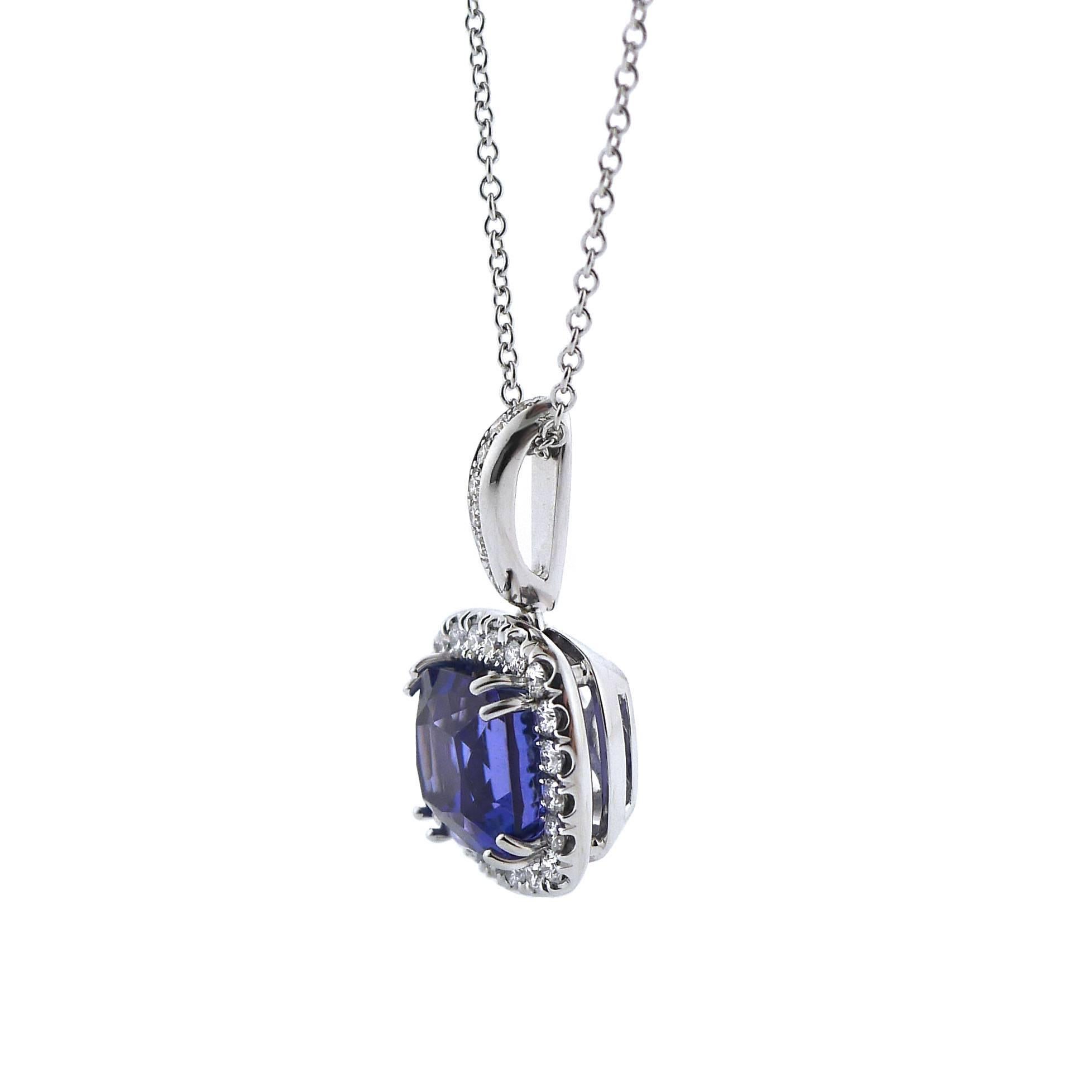 A modern style tanzanite pendant set with an intricately faceted, 3.24 carat, cushion-shaped tanzanite measuring 7.93 by 7.63 millimeters. The color saturation is intense and predominately blue with purple highlights and the clarity is excellent. 20