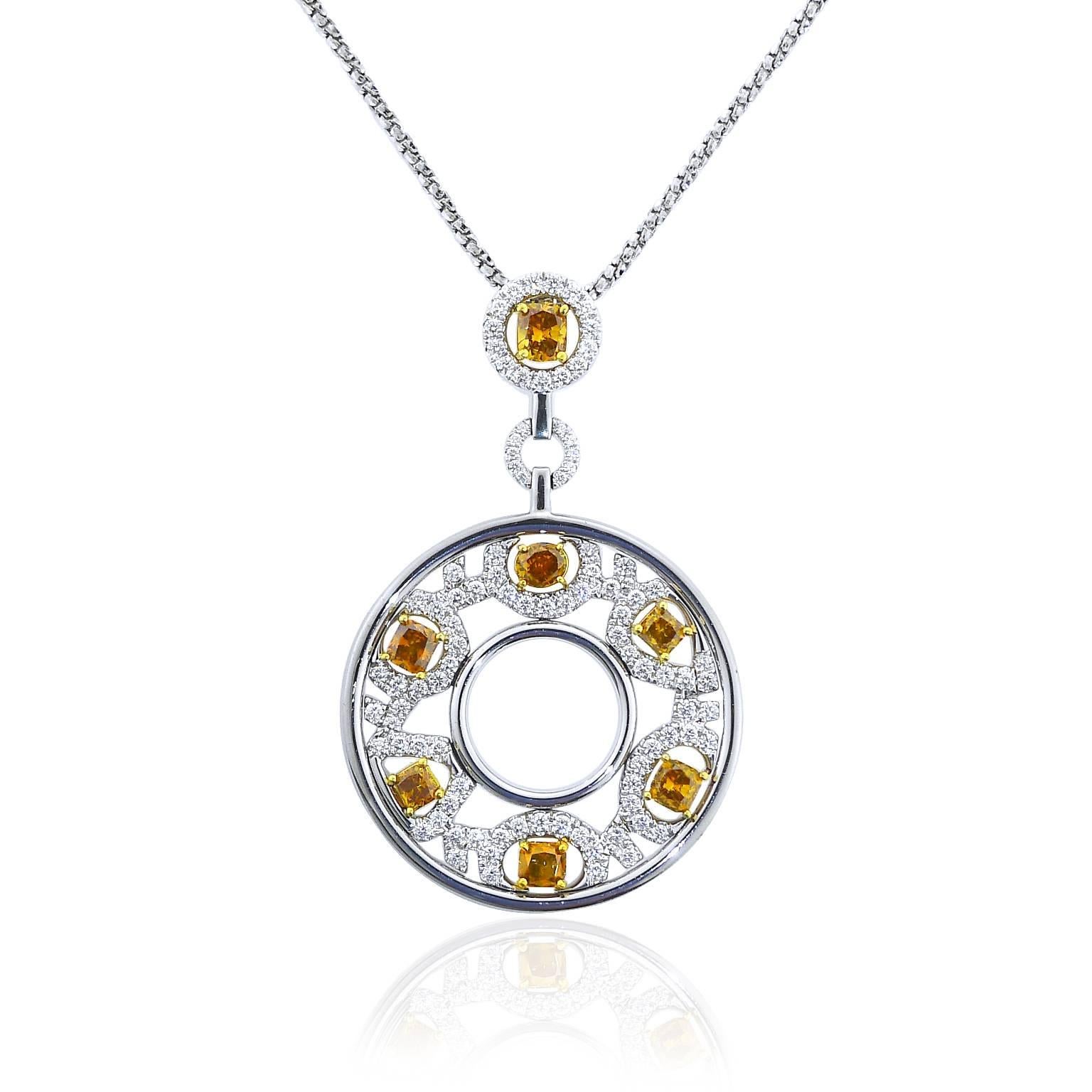 This 18 karat white gold bold and exciting necklace features 7 natural fancy color diamonds that total 3.27 carats and 96 round brilliant cut white diamonds that total 1.36 carats. Fancy diamonds are VS to SI clarity and white diamonds are F color,
