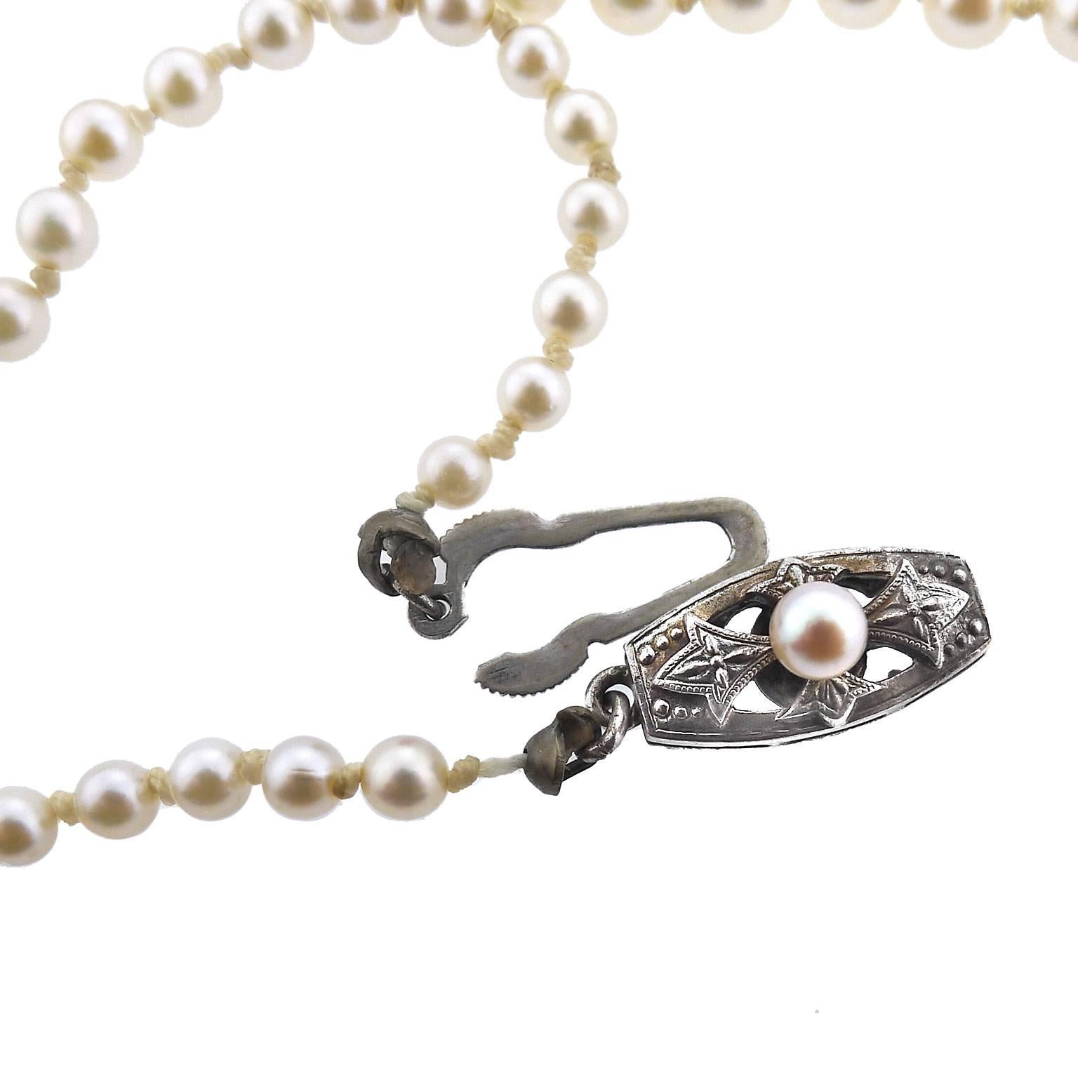 Strand of Graduated Mikimoto Cultured Pearls with Silver Clasp In Excellent Condition In Yardley, PA
