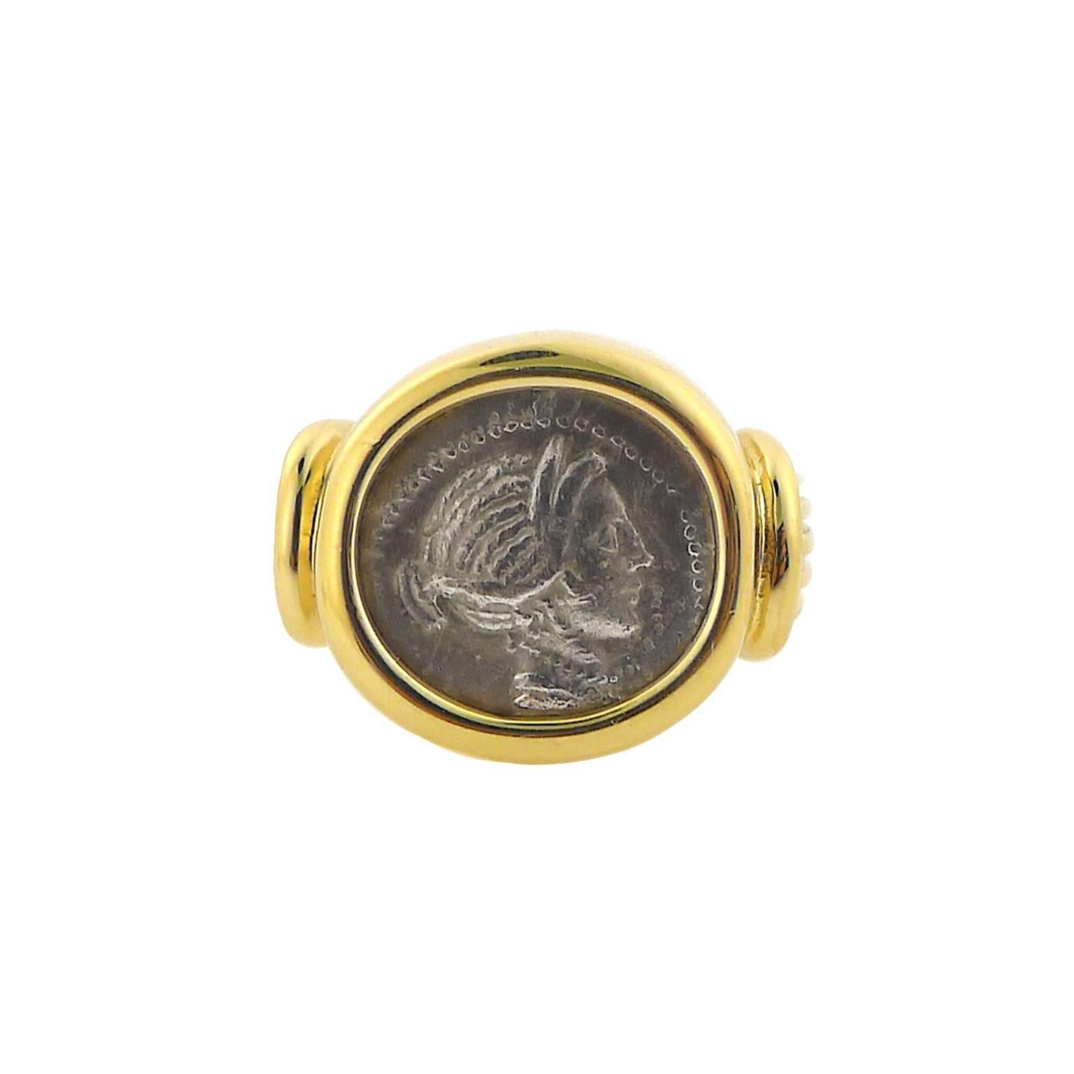 Silver Grecian coin, genuine in 14 karat yellow gold mounting .