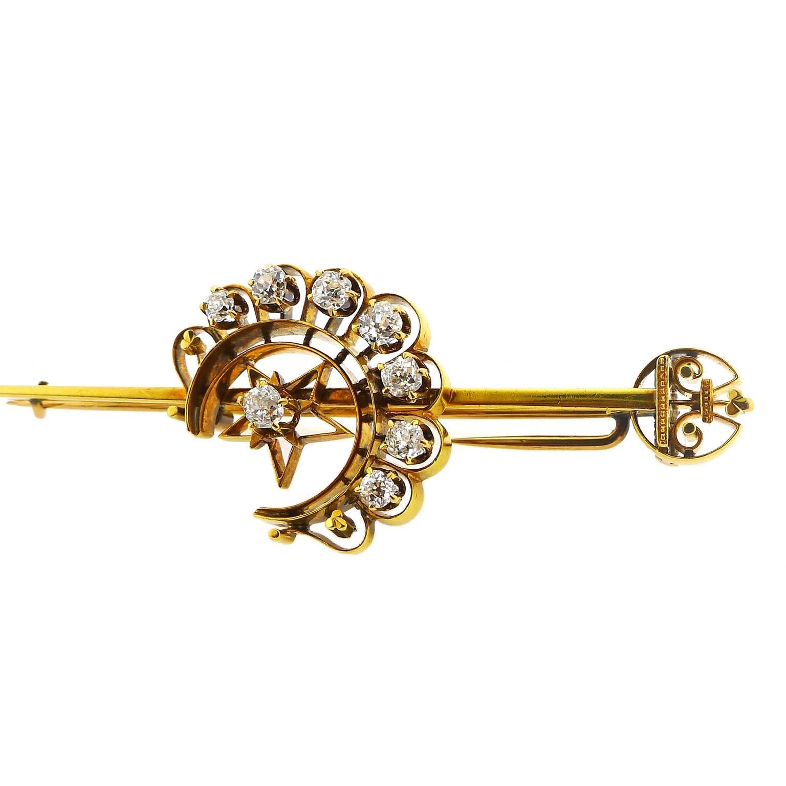 A 14 karat yellow gold diamond brooch set with 8 mine cut diamonds, graduating from 2.2 millimeters to 3.1 millimeters and totaling approximately 0.7 carats. Brooch is 2.5 inches long and 0.75 inches wide at its widest point.  Weight is 10.95 grams.