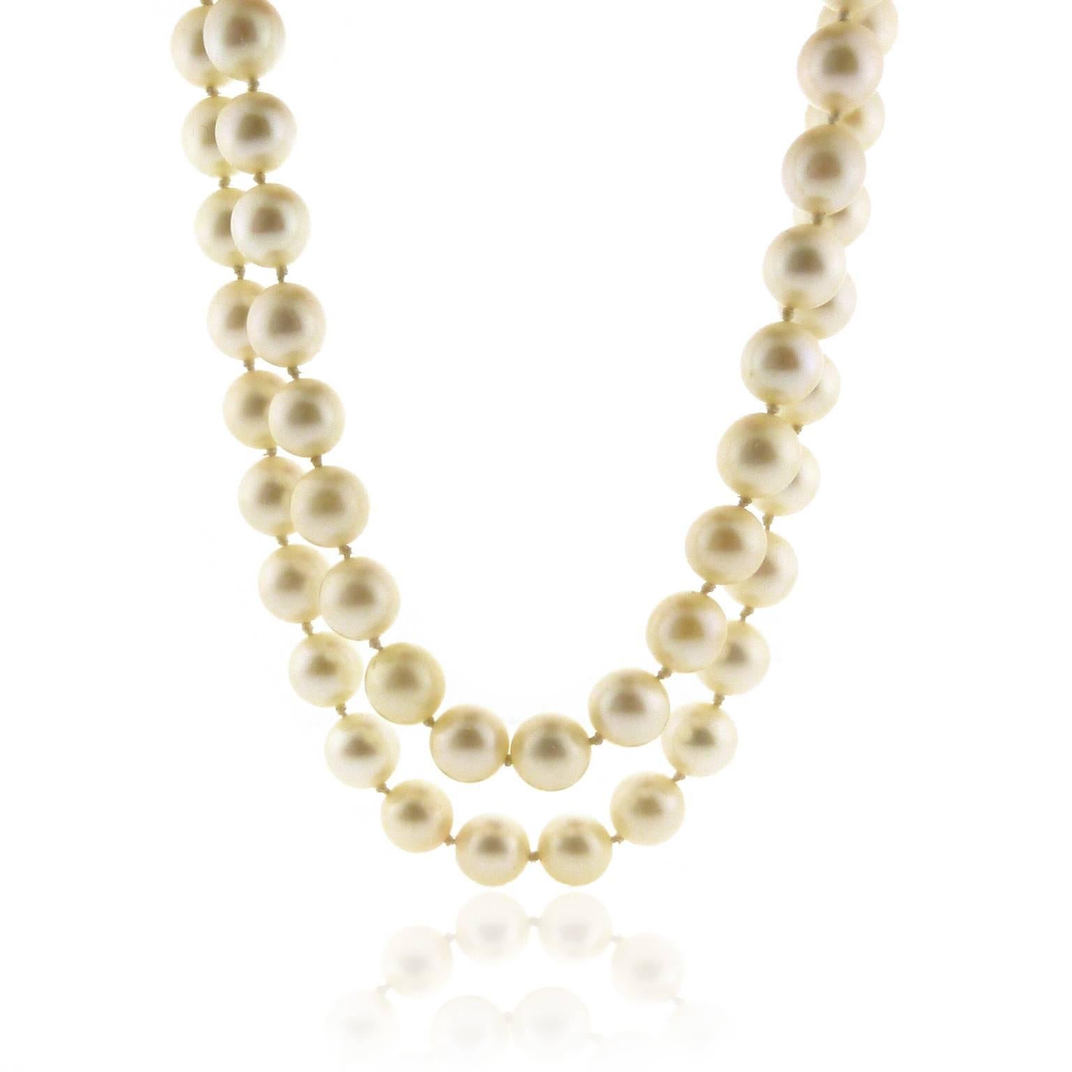 Two strands of cultured pearls measure 7.5 to 8.0 millimeter. Color is cream, luster is high, pearls are just off round, surface is very good. Shortest strand measures 14.75 inches including the clasp. Clasp is 14 karat white gold with 6 mine cut
