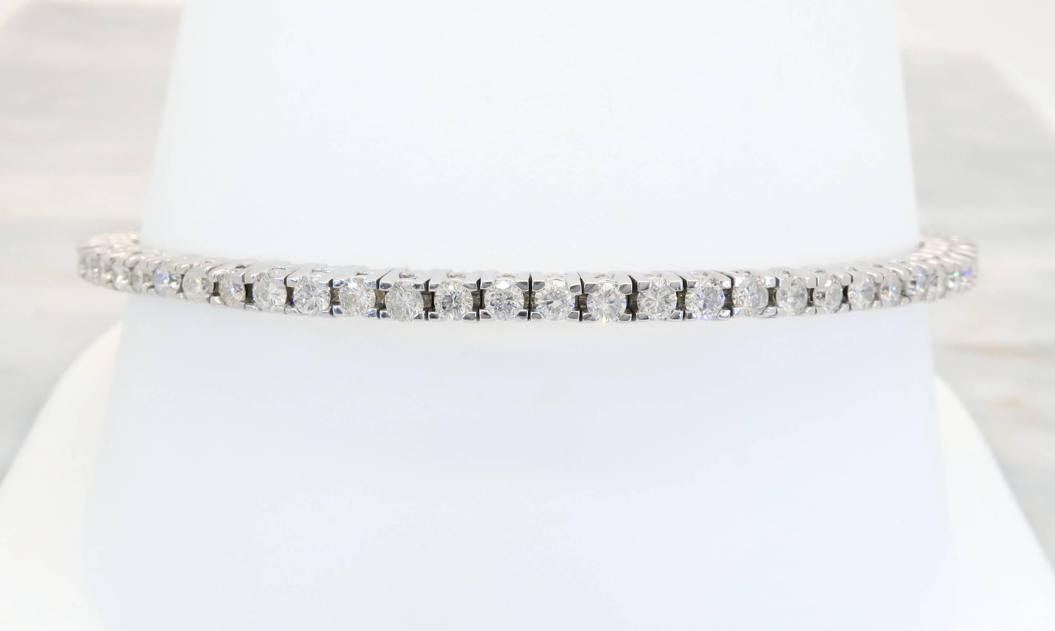 18k white gold and diamond bracelet holds 58 (fifty-eight) Round Brilliant cut diamonds. The diamonds have G-I color, and I-SI clarity with a total approximate carat weight of 2.32ctw. The bracelet is 6.5