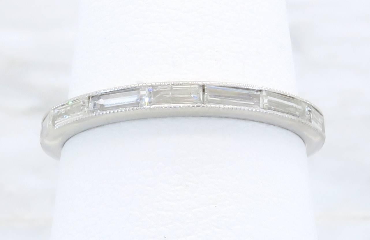 Platinum Eternity band with 16 (sixteen) Baguette Cut Diamonds. The diamonds have G-I color and VS2-I1 clarity. The total diamond weight is approximately .65CTW. The platinum eternity style ring is size 6.0 and weighs 1.9 grams.