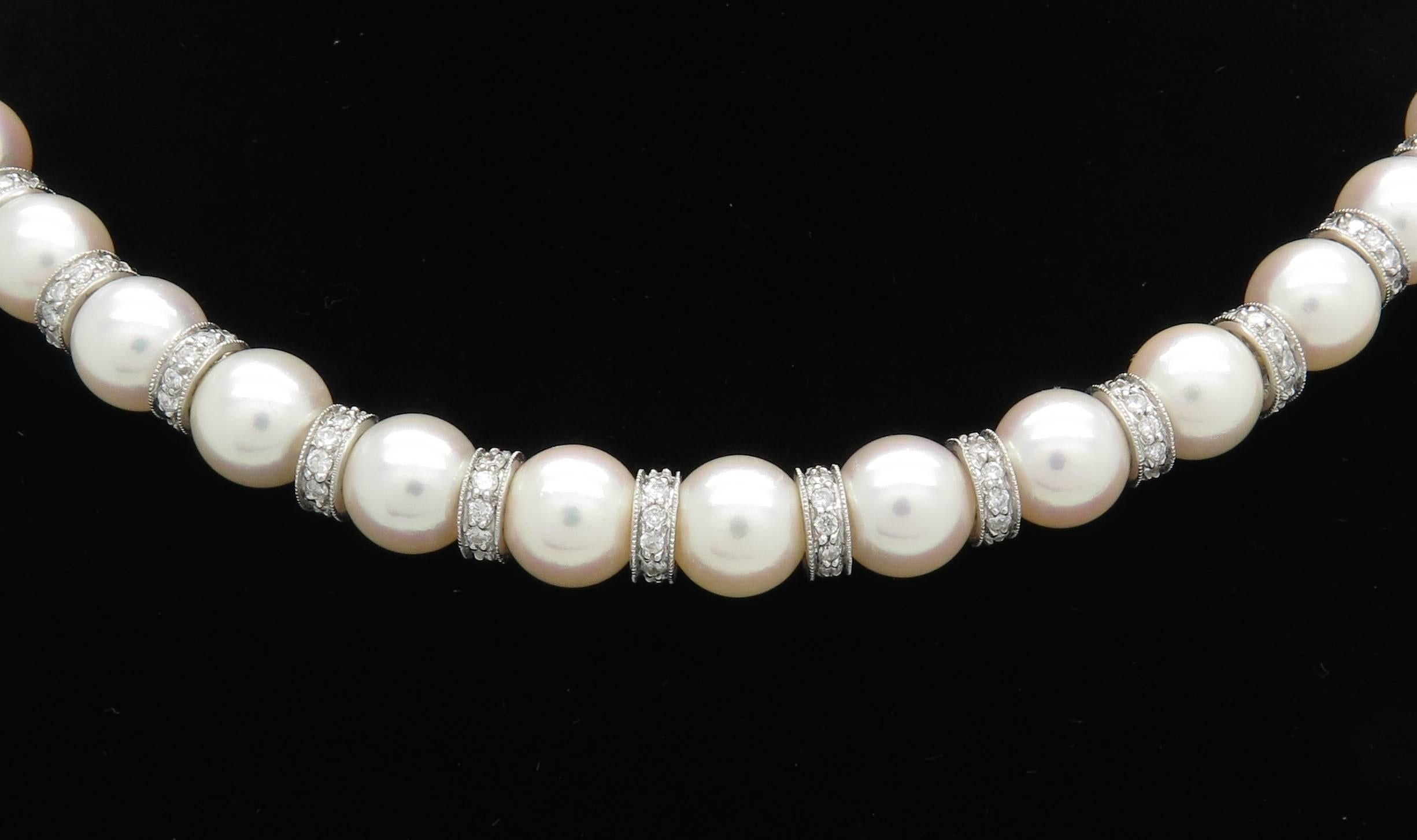 This impressive pearl necklace features 39 well matched 8.5MM pearls. There are 240 Round Brilliant Cut Diamonds throughout the necklace. The diamonds have F-H color and VS to SI clarity. The total diamond weight is approximately 3.60CTW. The 14K