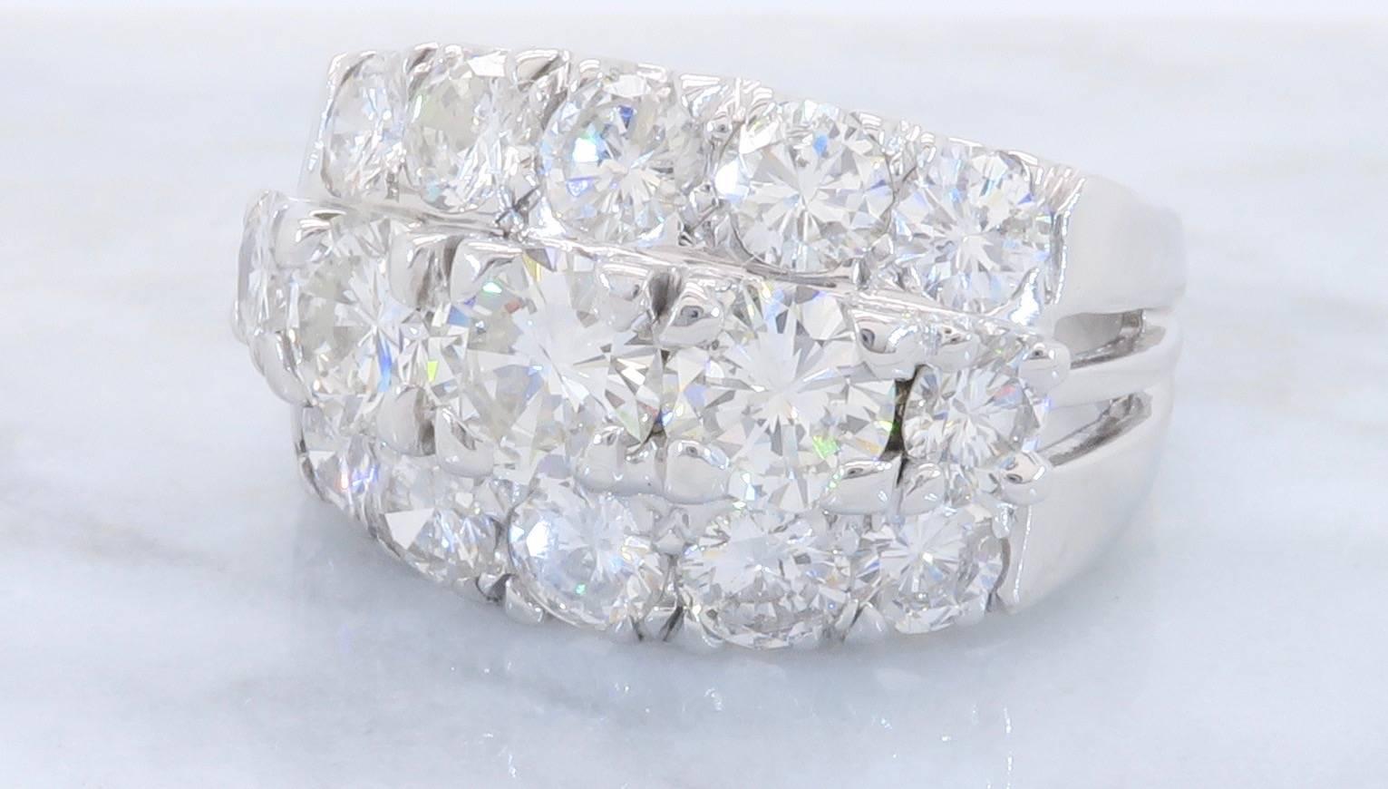This Glamorous 14K White Gold Diamond Ring features 15 beautiful Round Brilliant Cut Diamonds. The Diamonds are set into three attached rows. The Diamonds have an average color of G-I and have average SI to I clarity. This dazzling ring houses