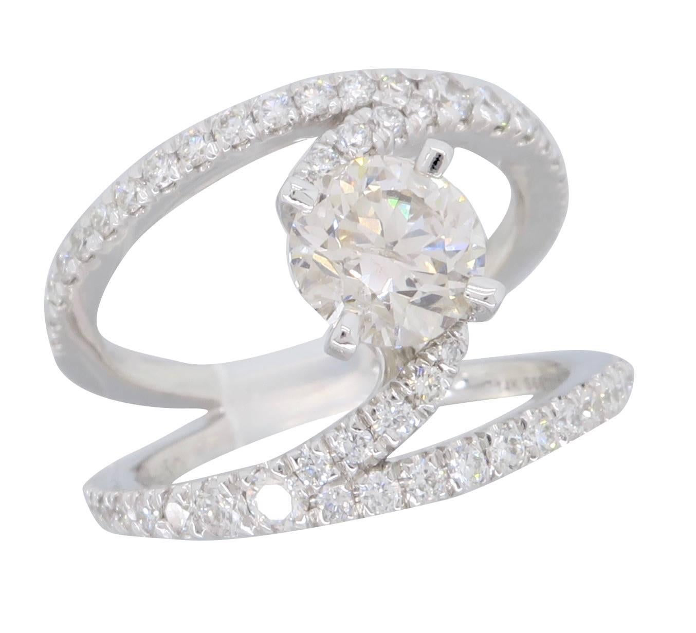 Gabriel & Co NOVA Renewal line ring with a 1.07CT Round Brilliant Cut center diamond. The diamond has K-L color and I clarity. It is accented by 54 more Round Brilliant Cut Diamonds set in a French pave split shank setting. The total diamond weight