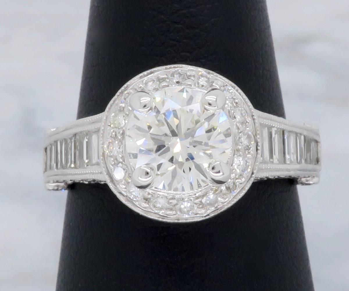 Stunning diamond engagement ring featuring an approximate 1.15ct Round Brilliant Cut Diamond with J-K color and SI1 clarity. There are 84 additional Round Brilliant Cut Diamonds placed in a halo around the featured Diamond as well as throughout the