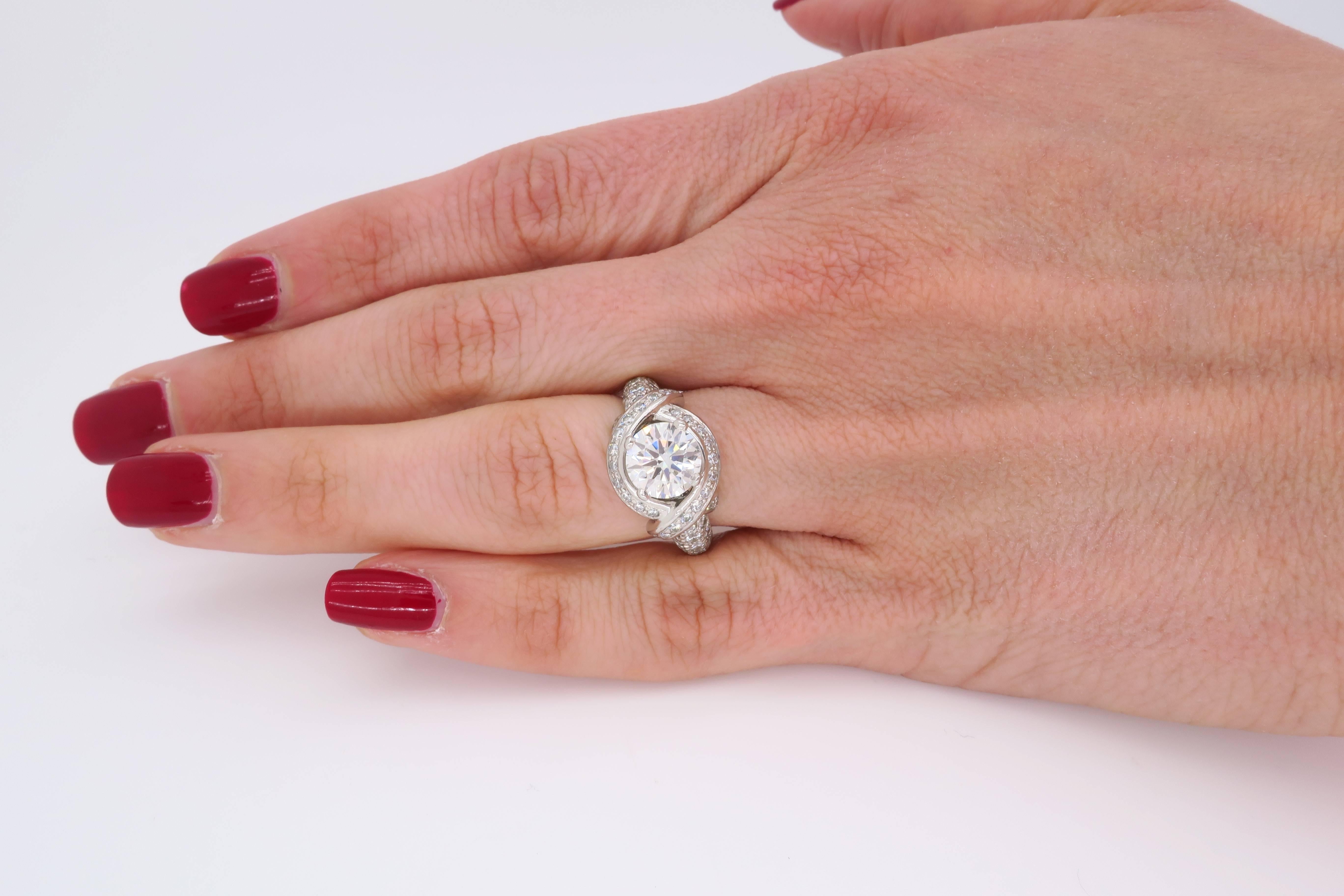 Authentic Tiffany & Co. ring is master designer Jean Schlumberger’s signature engagement ring. The Platinum ring features a beautiful 1.54CT Round Brilliant Cut Diamond certified by Tiffany & Co. The featured Diamond has H color and VVS2 clarity.