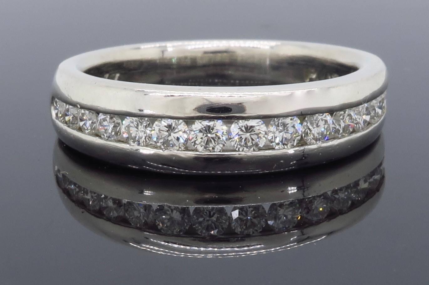 Designer Scott Kay diamond band features 15 Round Brilliant Cut Diamonds totaling approximately .50CTW. The diamonds are channel set in platinum band.  he ring weighs 6.8 grams and is a size 5.5.