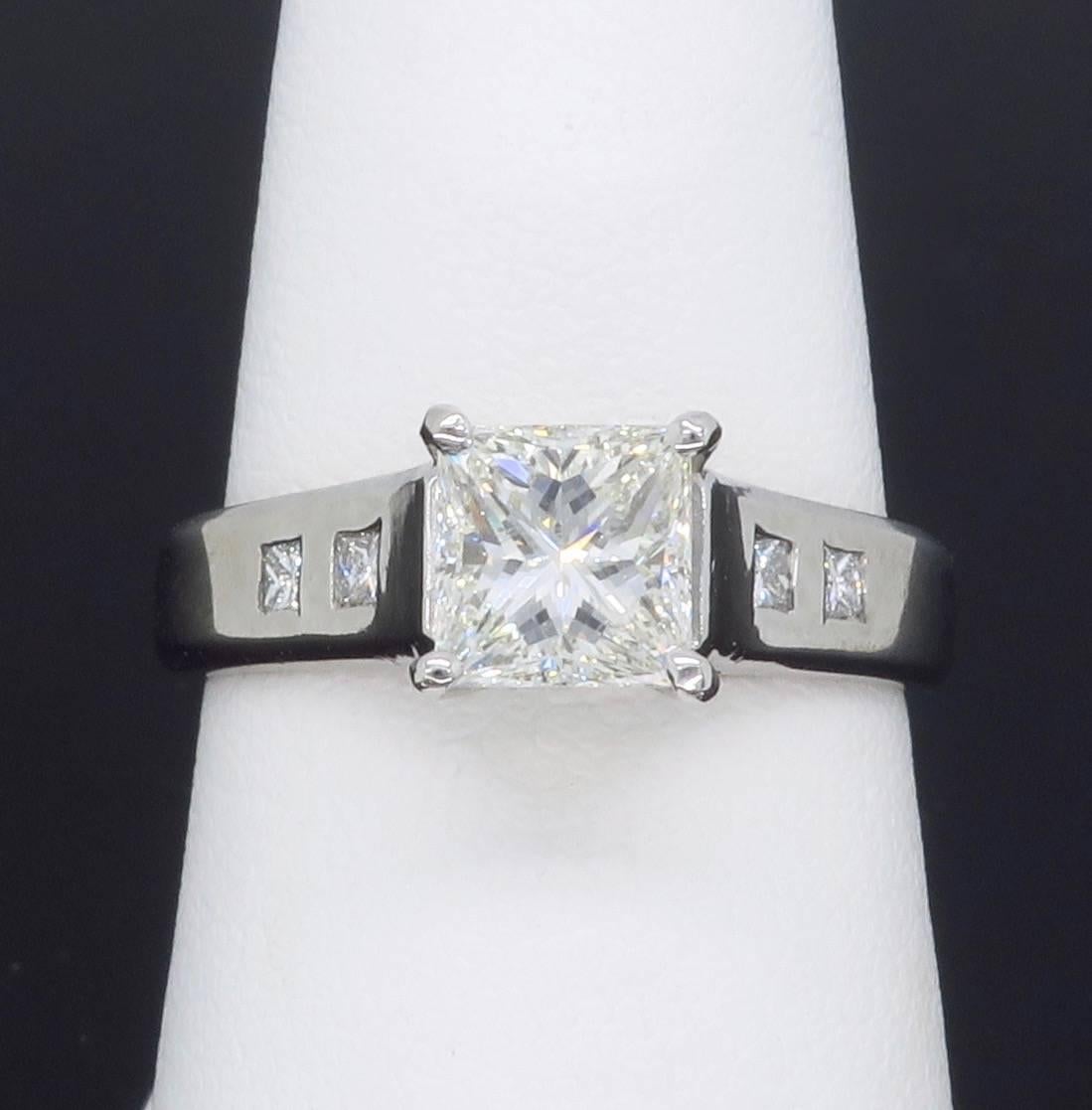 “Eden Engagement Ring” from designer Jeff Cooper’s “Ever Collection”.  The Platinum ring features a beautiful 1.06CT Princess Cut Diamond in the center with J-K color, VVS. The featured diamond displays J-K color and VVS2 clarity and is laser