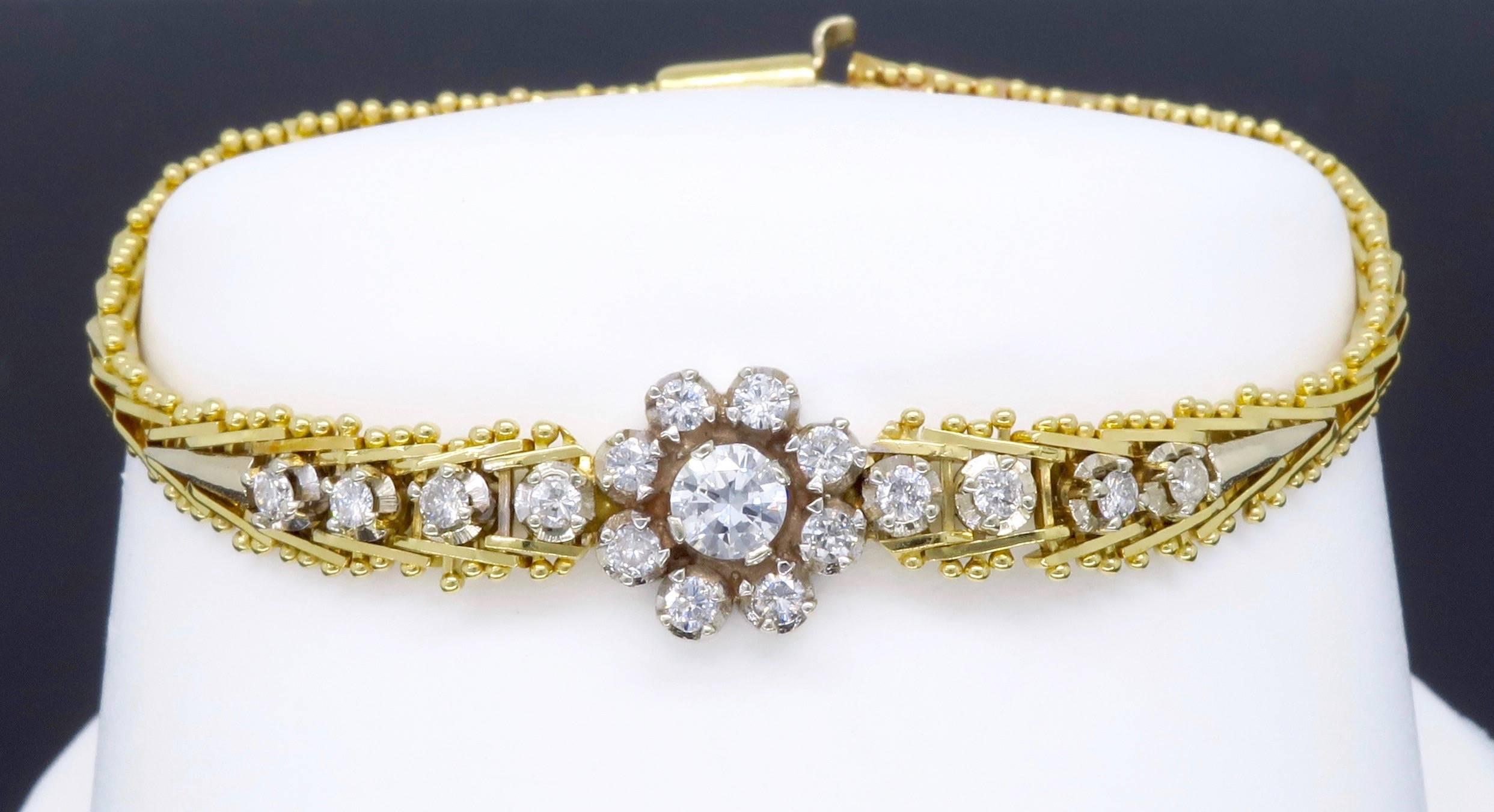 This dainty 14K gold bracelet features a .25CT Round Brilliant Cut Diamond. The featured diamond is set in a pretty floral design made up of 16 additional Round Brilliant Cut Diamonds. The beautiful featured diamond displays SI1 clarity and G-H
