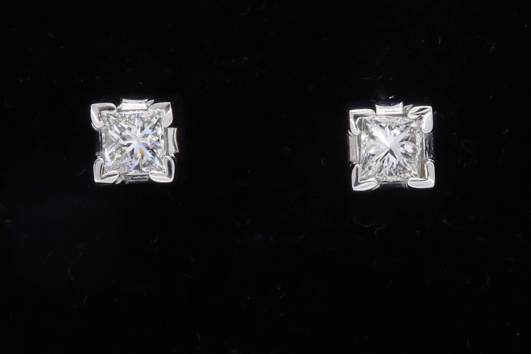 These beautiful earrings feature two Princess Cut Diamonds. The diamonds have G-H color and SI clarity. The total diamond weight is approximately .50CTW. The 14K white gold earrings weigh 1.3 grams.