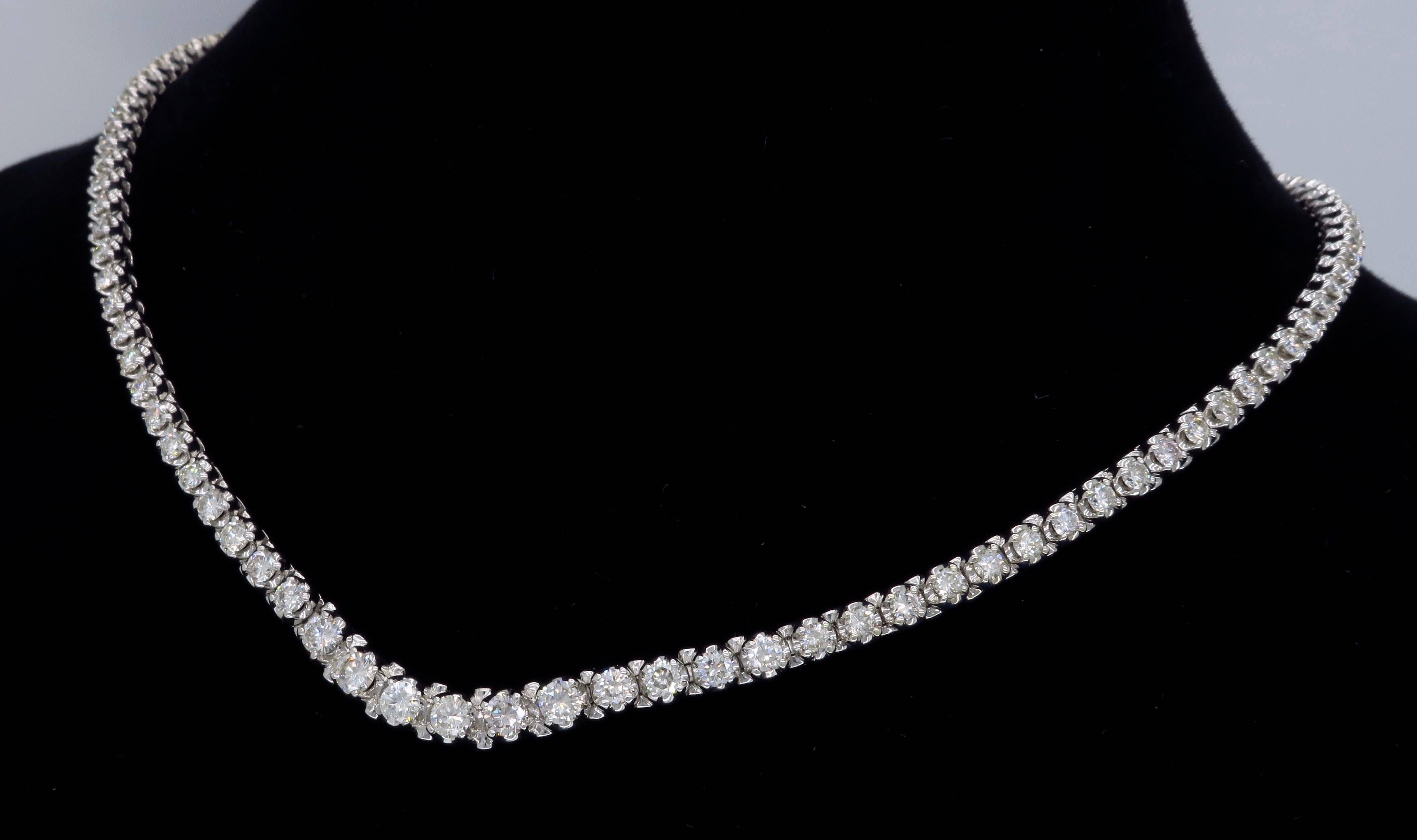 Stunning necklace features 108 Round Brilliant Cut Diamonds with an average color of G-I and an average clarity of VS1-SI2. There is approximately 5.75CTW of diamonds in this beautiful necklace. The 14K White gold necklace weighs 31.1 grams and is
