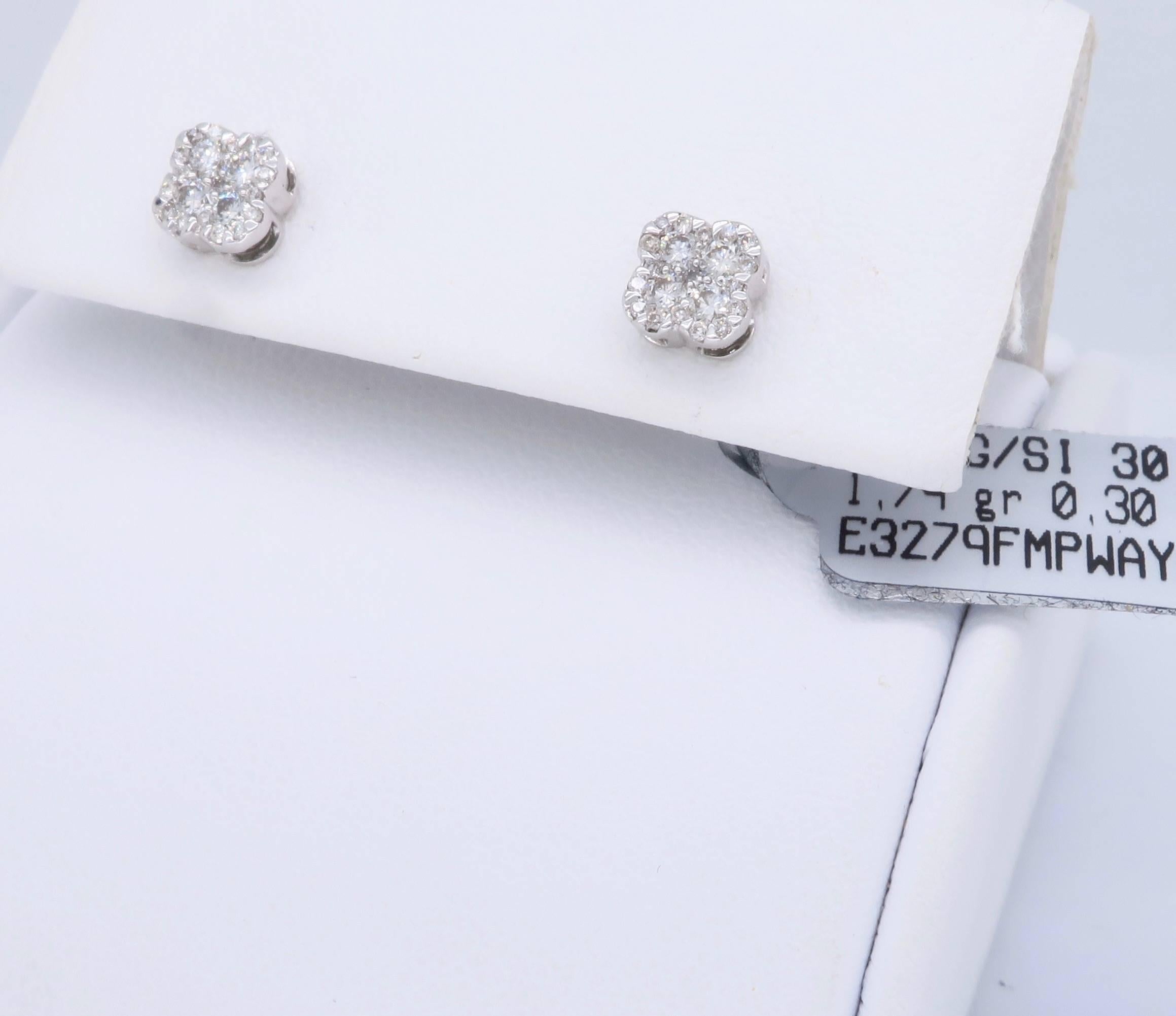 Pair of studs with .30CTW of Round Brilliant Cut Diamonds set into an elegant clover shape. The diamonds have G color and SI clarity. These New 14K white gold earrings weigh 1.4 grams.