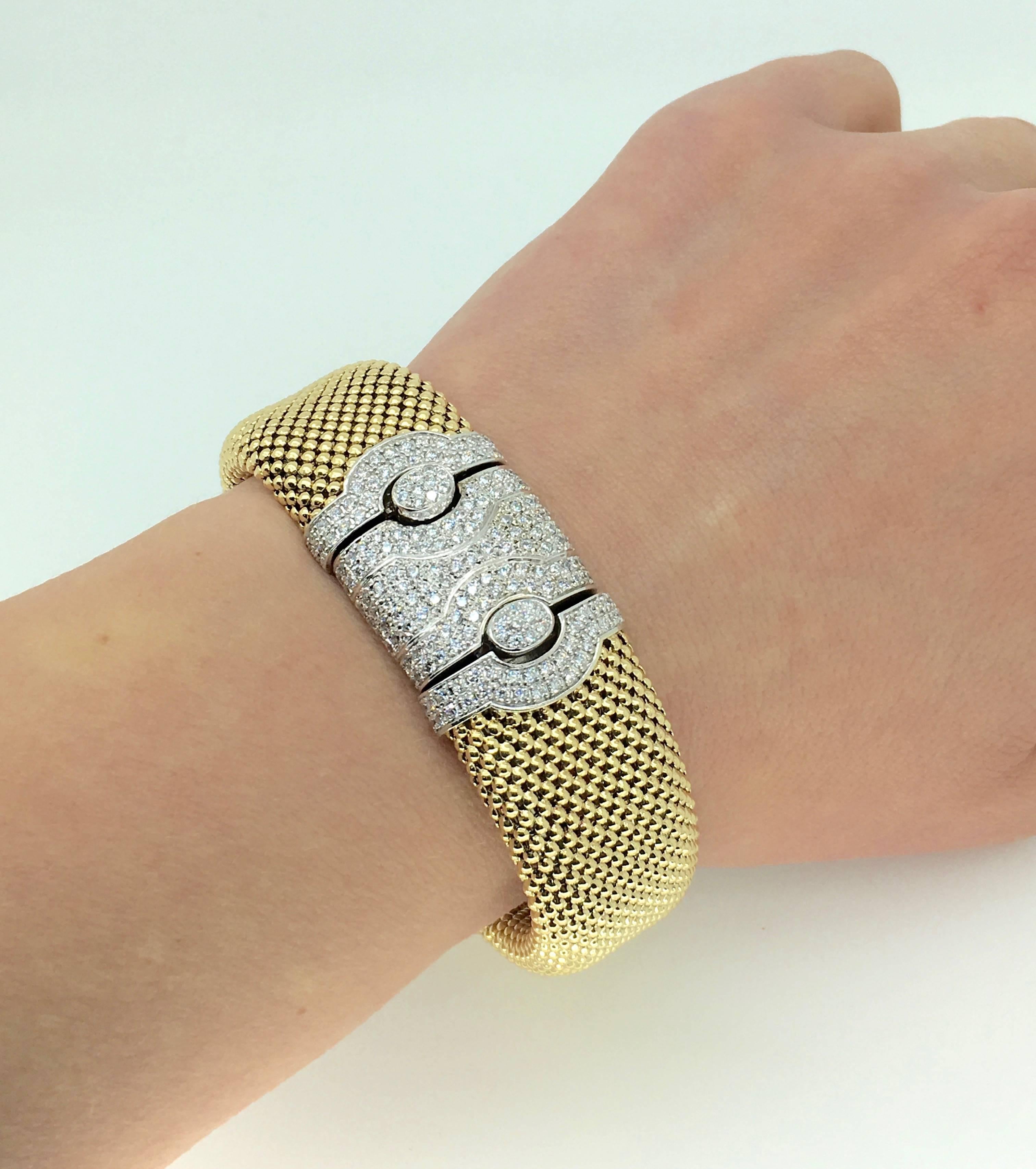 Gorgeous mesh 14K yellow gold bracelet features 193 Round Brilliant Cut Diamonds. The clasp is a well crafted concealed box clasp encrusted with diamonds. There is 2.75CTW of diamonds in this stunning piece, the diamonds display an average of G-H