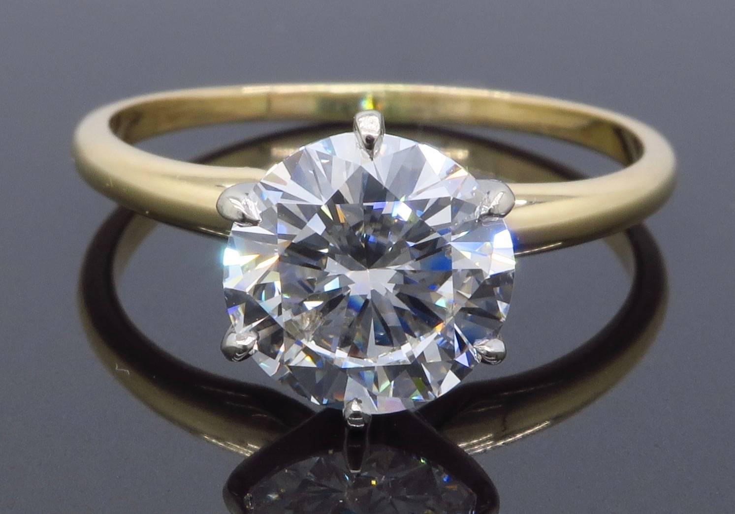 Solitaire diamond engagement ring features a GIA Certified 2.01CT Round Brilliant Cut Diamond with G color and VS2 clarity.  The 14K Yellow Gold ring weighs 3.0 grams, and is currently a size 9. This ring is sizable.   
GIA Certification # 5066072