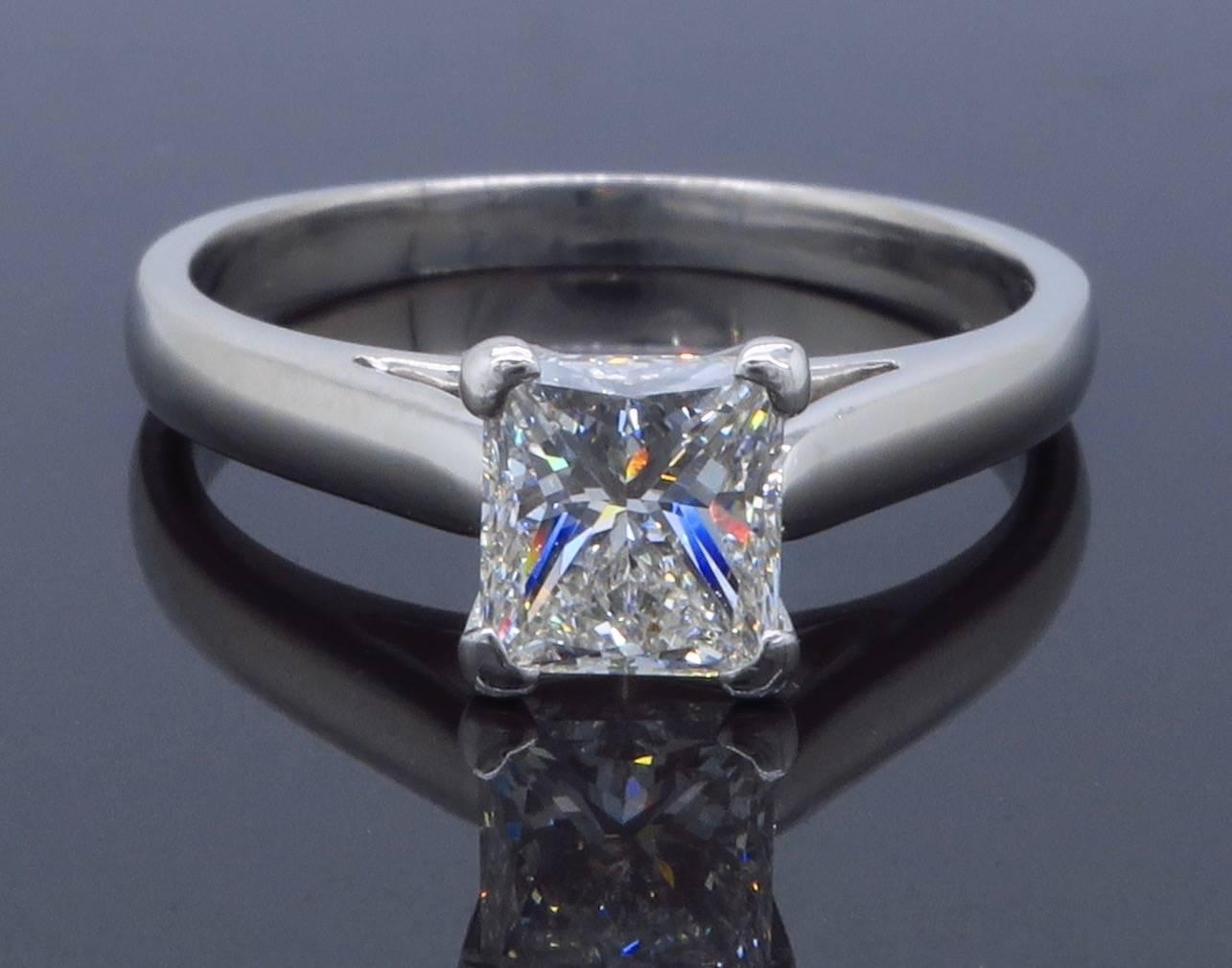 Platinum solitaire engagement ring features a GIA Certified 1.01CT Princess Cut Diamond with H color and VS2 clarity. The ring is currently a size 7 and weighs 5.1 grams.