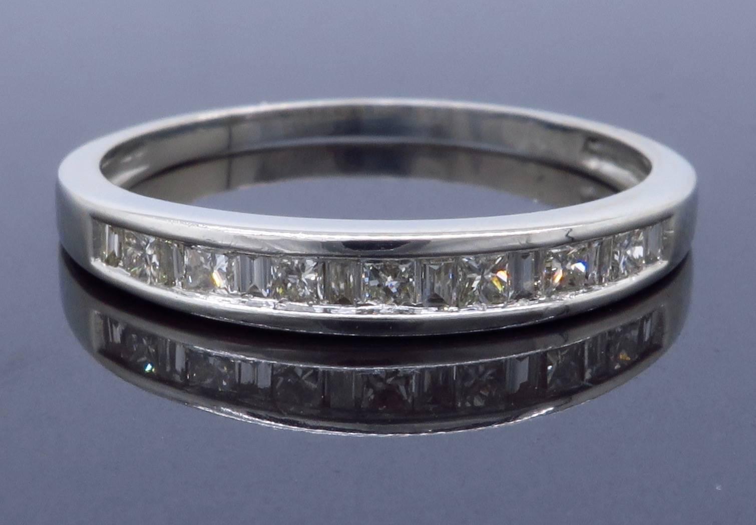 Platinum diamond band featuring 7 Princess Cut Diamonds and 8 Baguette Cut Diamonds with H-J color, VS-SI clarity. There is approximately .35CTW of diamonds in this beautiful band. Currently the ring is a size 7 and weighs 2.5 grams.