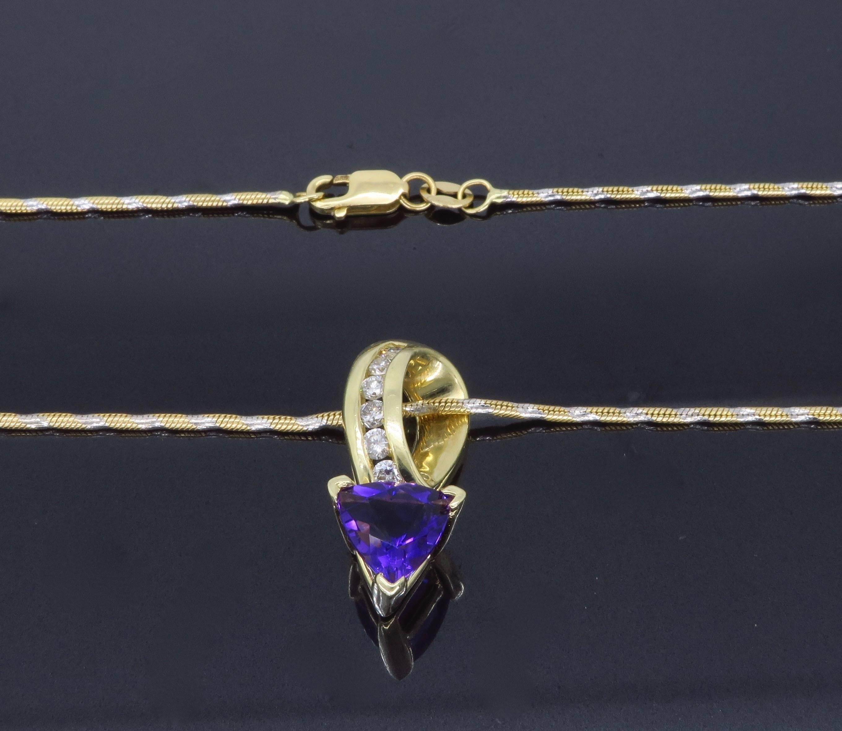 Unique 14k gold pendant features a 7x7.40mm Trilliant Cut Amethyst accented by 6 Round Brilliant Cut Diamonds, for a total diamond carat weight of approximately .20ctw. The diamonds display G-I color and VS-SI clarity. The 14k necklace is 18” in