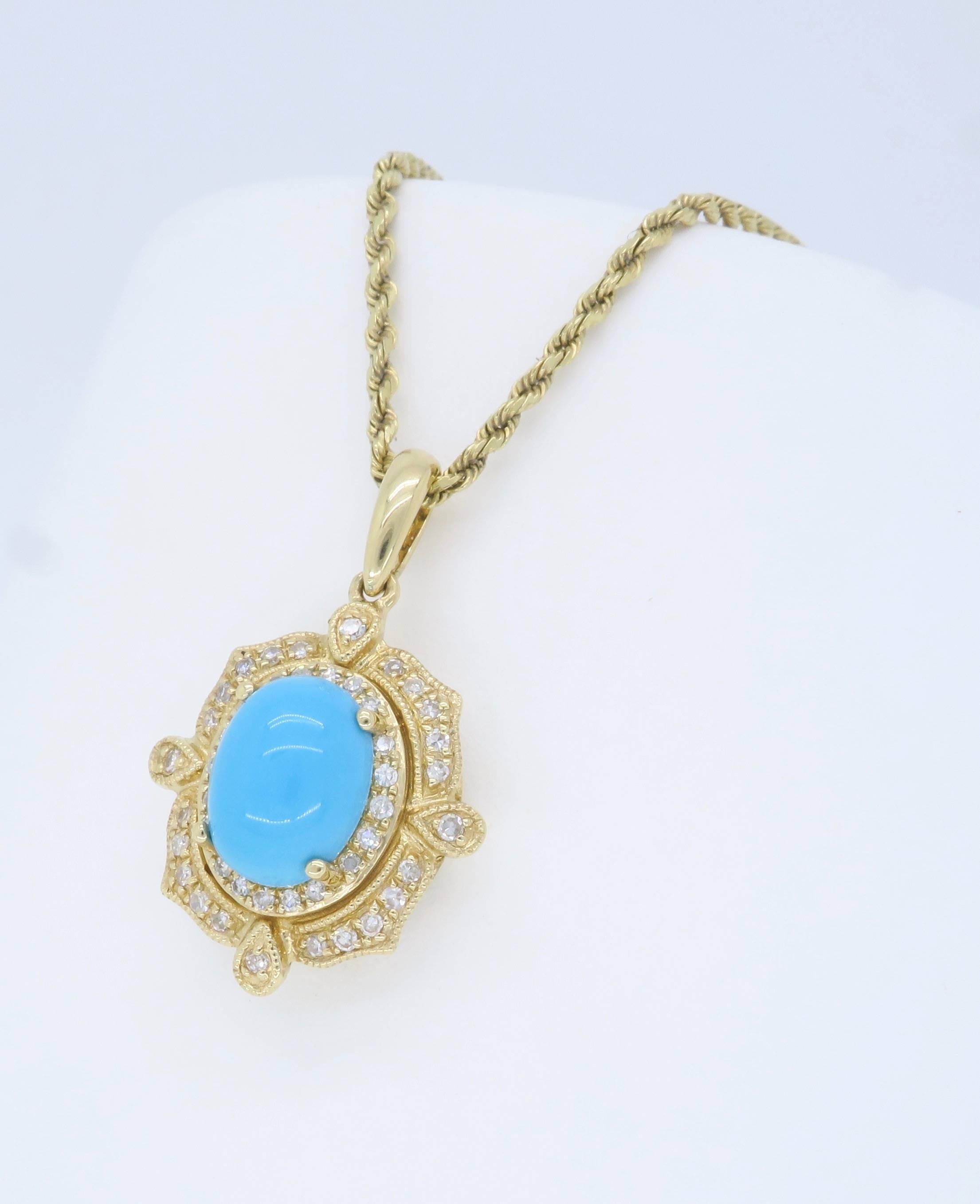 Designer necklace features an approximate 6x8mm Turquoise surrounded by a elegant display of approximately .15CTW of Single Cut Diamonds. The 14K yellow gold necklace is 18.5” long and weighs 5.8 grams. The necklace is stamped with the makers mark