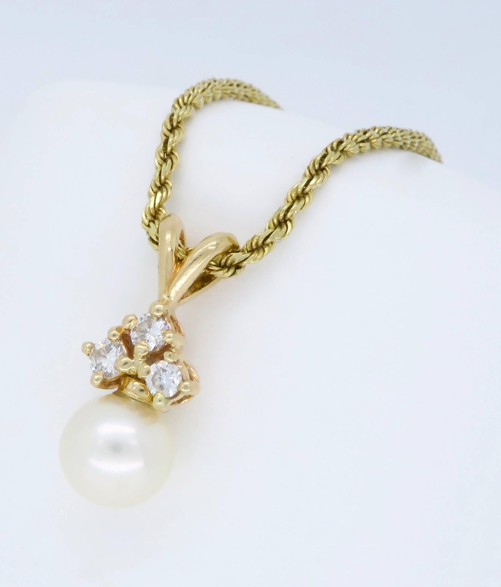 Classic drop necklace features an approximately 8.10mm Round Pearl, the pearl is accented by three Round Brilliant Cut Diamonds totaling approximately .18CTW.  The 14K yellow gold necklace is 18” in length and weighs 7.5 grams. The necklace is