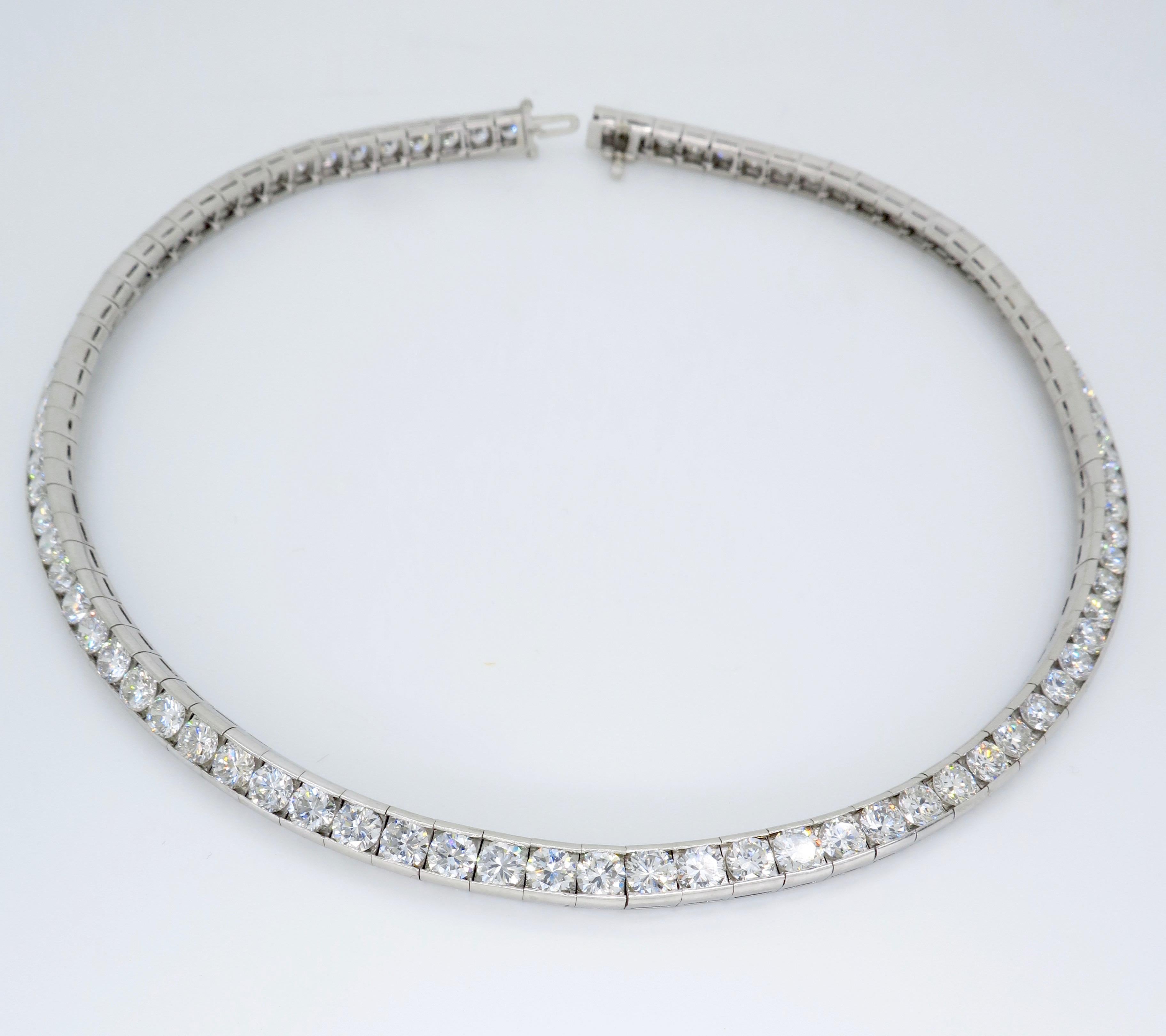 Absolutely stunning platinum choker featuring approximately 25ctw of Round Brilliant Cut Diamonds.

Total Diamond Carat Weight:  Approximately 25.00CTW
Diamond Cut: 87 Round Brilliant Cut 
Color: Average F-H
Clarity: Average VS1-VS2
Metal: