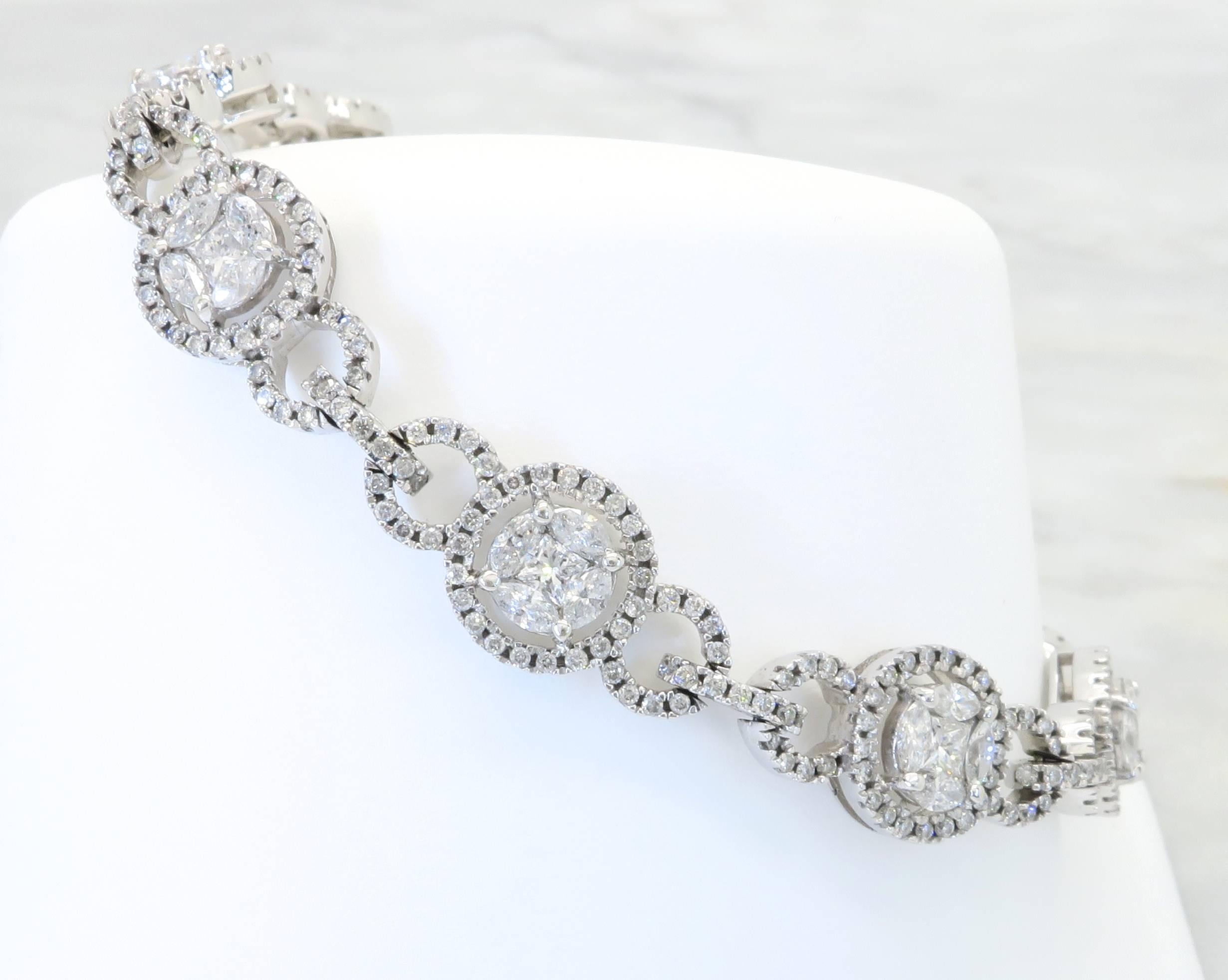 14k white gold diamond bracelet with 396 (three hundred ninety six) Round Brilliant Cut Diamonds, 36 (thirty-six) Marquise Cut Diamonds and 9 (nine)  Princess Cut Diamonds. The diamonds have G-I color and I-SI clarity. The total diamond weight is