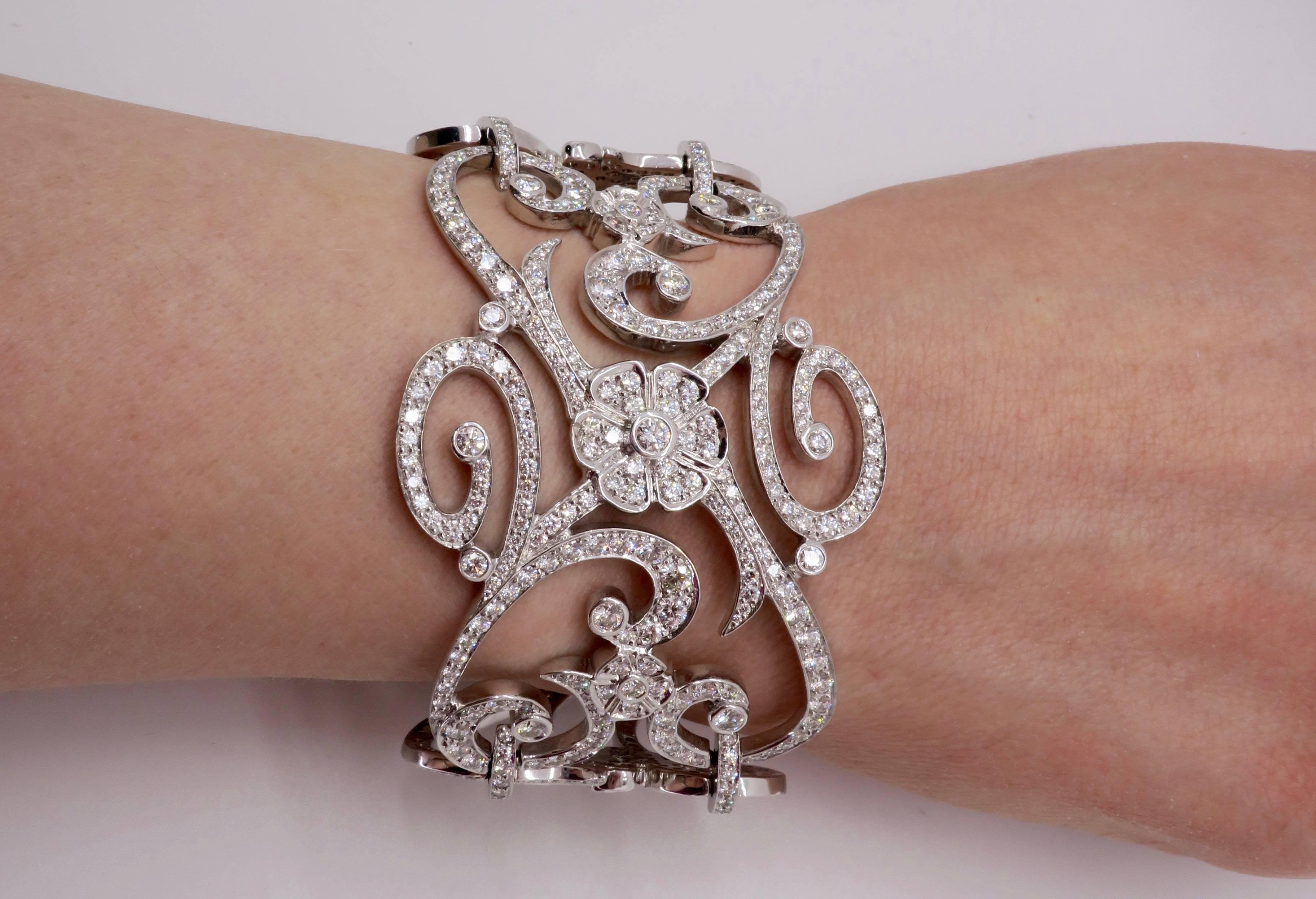 This jaw dropping Penny Preville bracelet features a stunning array of Round Brilliant Cut Diamonds. The diamonds have an average of F-I color and an average of VS to SI clarity. The total diamond weight is approximately 13.37CTW. The 18K white gold