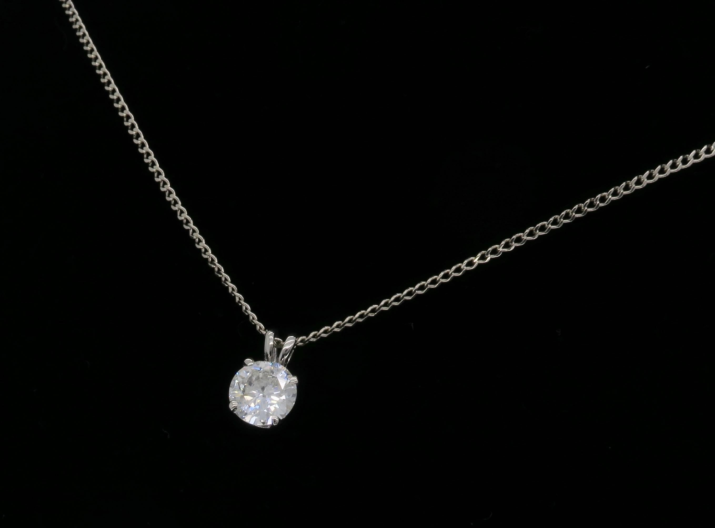 This pendant features a 1.11CT Round Brilliant Cut Diamond. The diamond has J-K color and I1 clarity. The 14K gold necklace is 19" long and weighs 3.2 grams.
