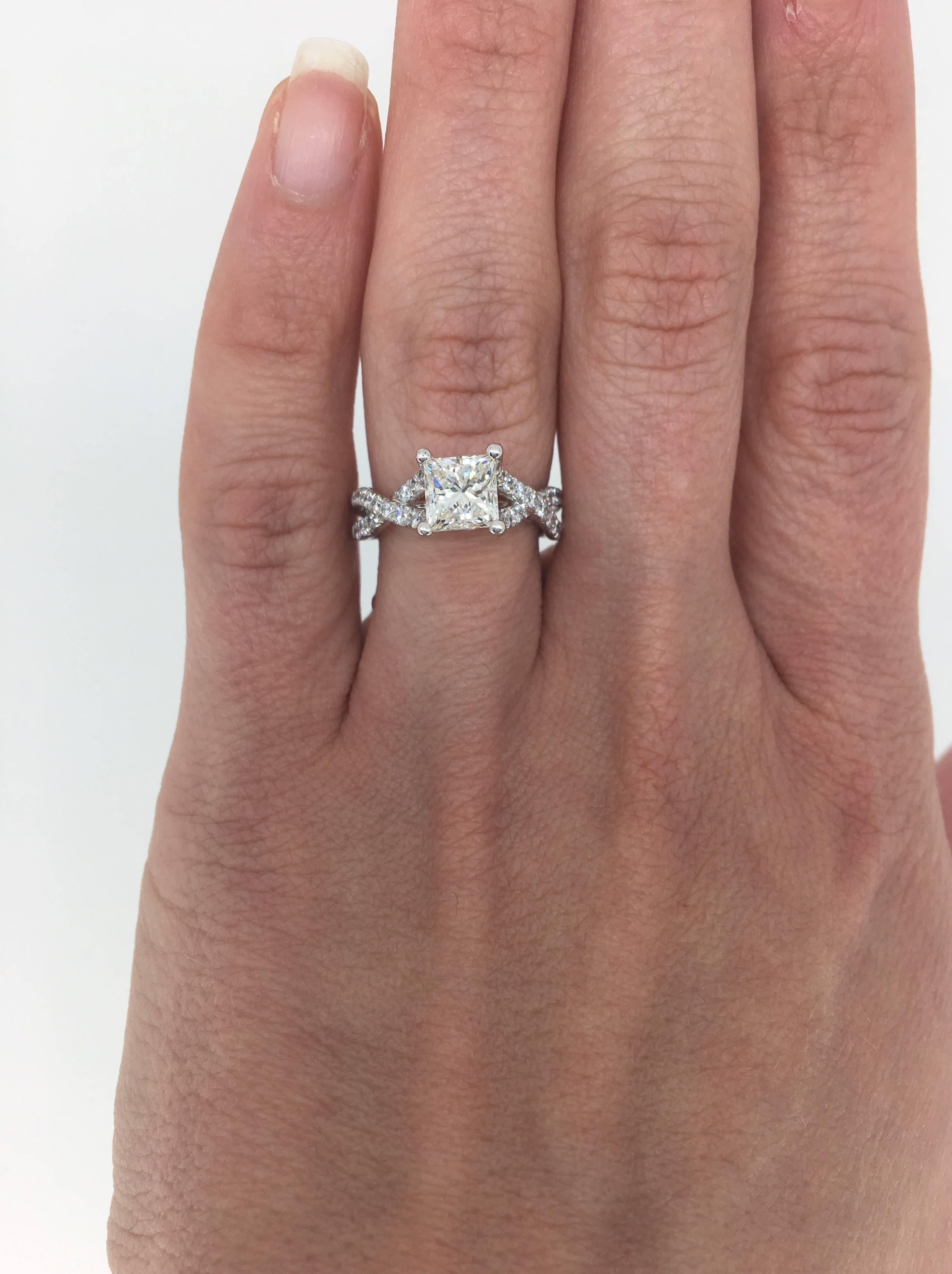Verragio engagement ring in 18K White Gold with an approximate 1.23ct Princess cut  center diamond. The diamond has K-L color and  VS clarity. There are 28 additional Round Brilliant Cut Diamonds cascading down the beautiful split shank. To add a