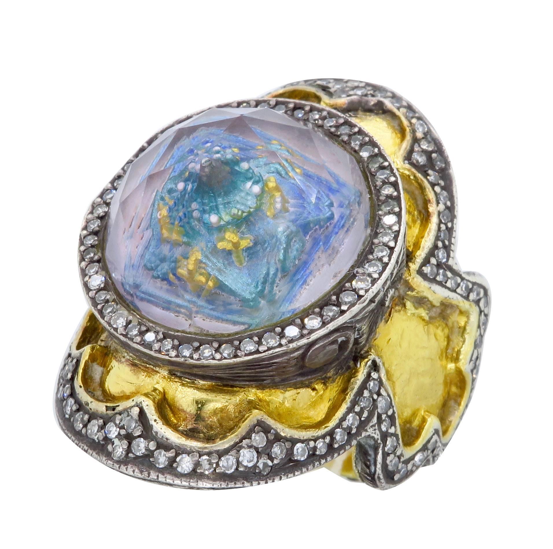 Hand crafted by the exclusive designer Sevan Biçakçi from his Theodora collection. All of Sevan's rings are one of a kind. The ring is 24K yellow gold with sterling silver accents. It features a large reverse cut amethyst that contains a beautiful