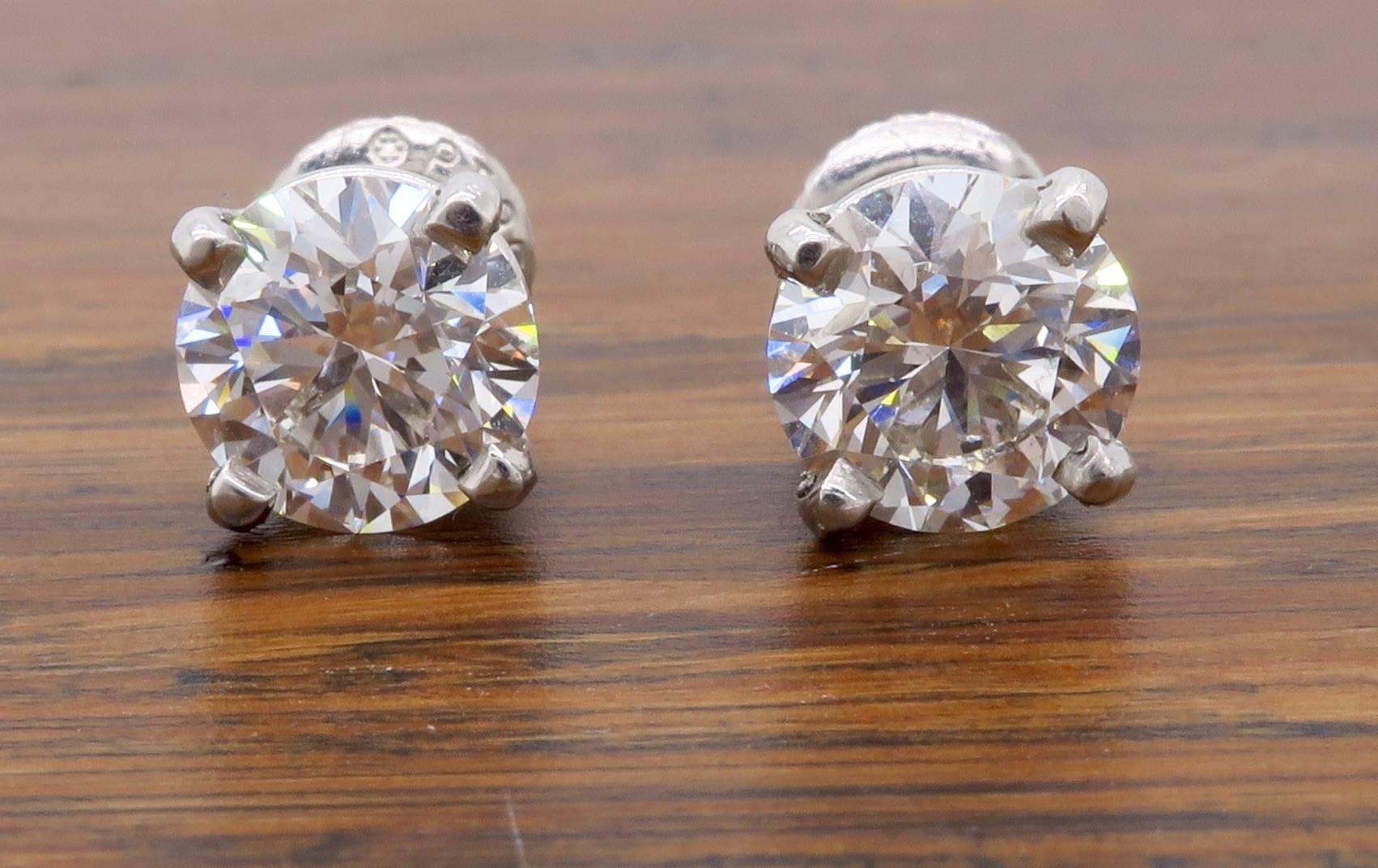 These classic studs featured two AGS Certified Hearts On Fire Diamonds. One diamond weighs 1.03CT the other diamond weighs 1.04CT. The stunning diamonds have G color and SI2 clarity. There is 2.07CTW of diamonds in this beautiful pair. The platinum