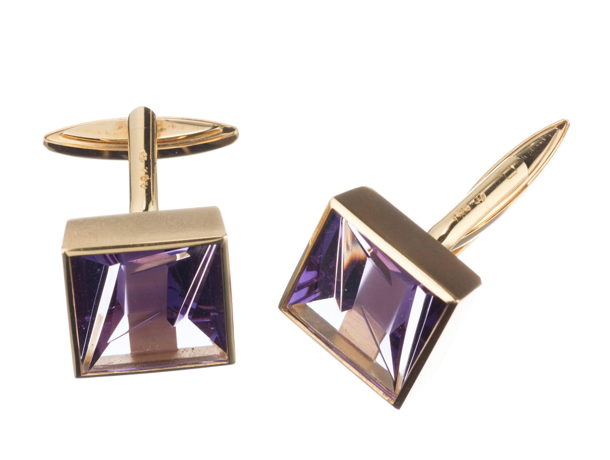 Mesmerizing to behold, a pair of 18-karat yellow gold cufflinks set with two fantasy-cut amethysts. The gemstones, a restrained and accessible example of artist Bernd Munsteiner’s renowned gem-cutting technique, draw the viewer in with a suggestion