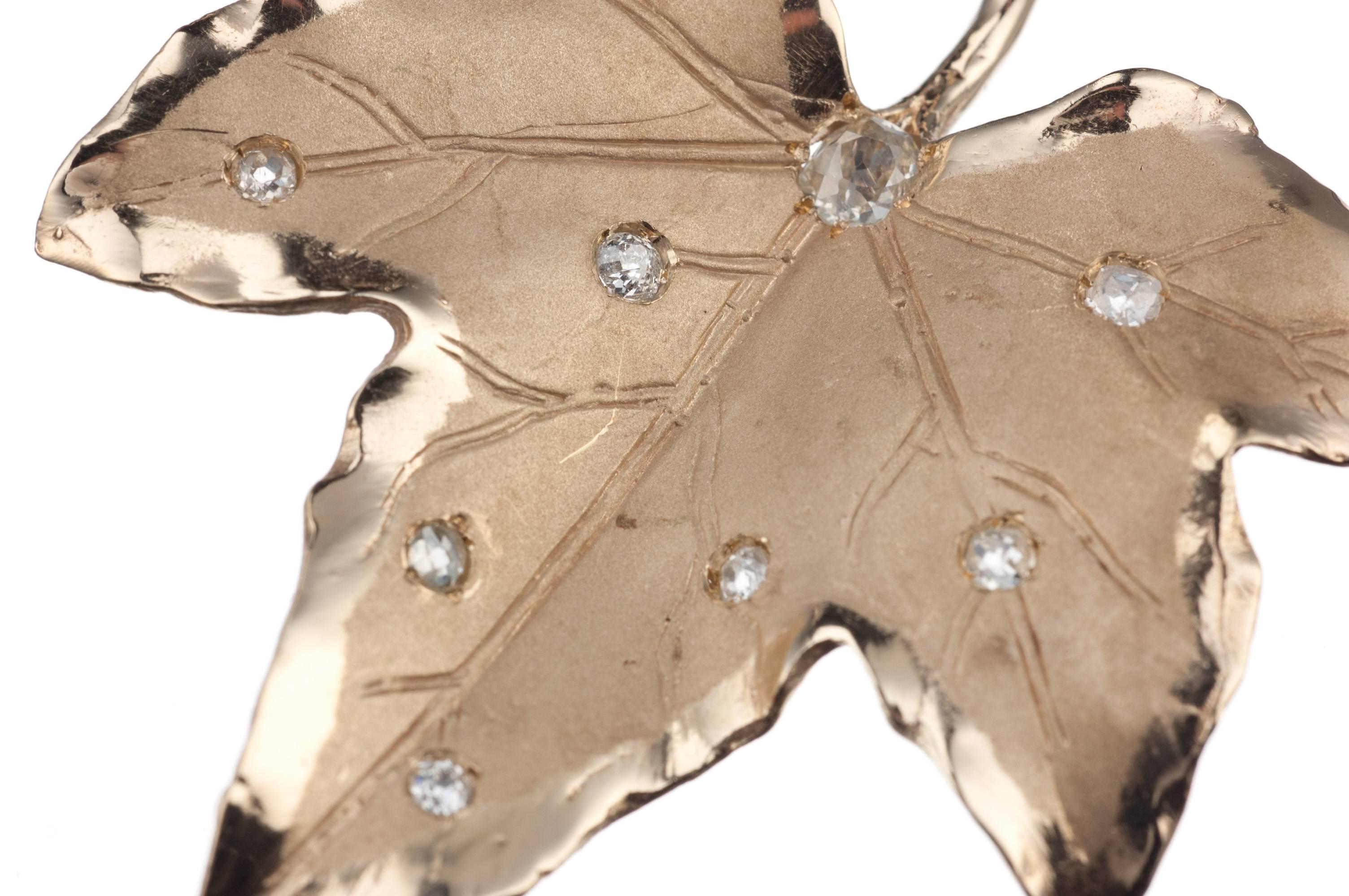 An elegant mix of natural motifs and the mannerisms of fine jewelry craftsmanship, this leaf brooch in 14-karat yellow gold features nine Old Mine cut diamonds, approx. .73ctw. of SI2-I1 clarity. The brooch measures approx. 2” wide by 2” long. 