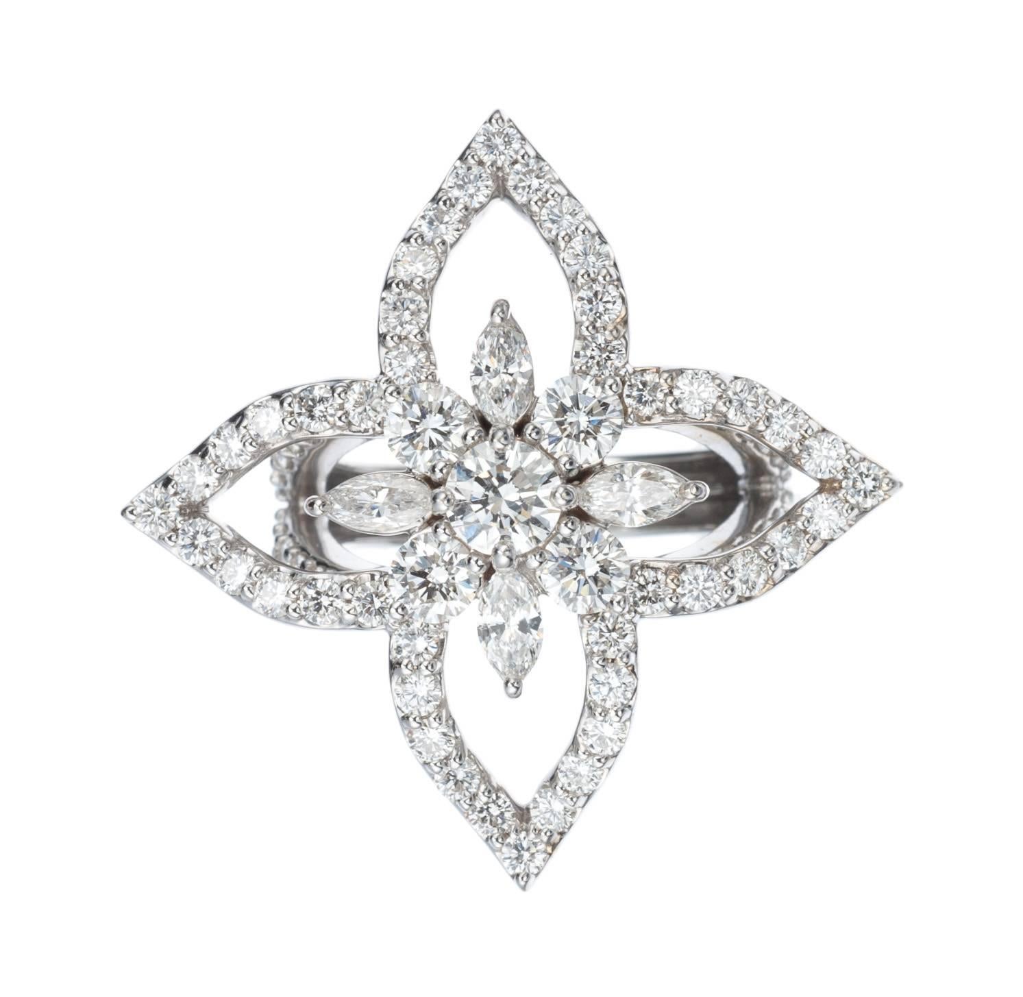 The echo of marquise diamonds in the open-work petals. The gently upturned tips of each petal. It is subtlety of form that gives this floral ring its allure. Set in 18-karat white gold, a mix of diamond shapes and sizes compose the flower, including