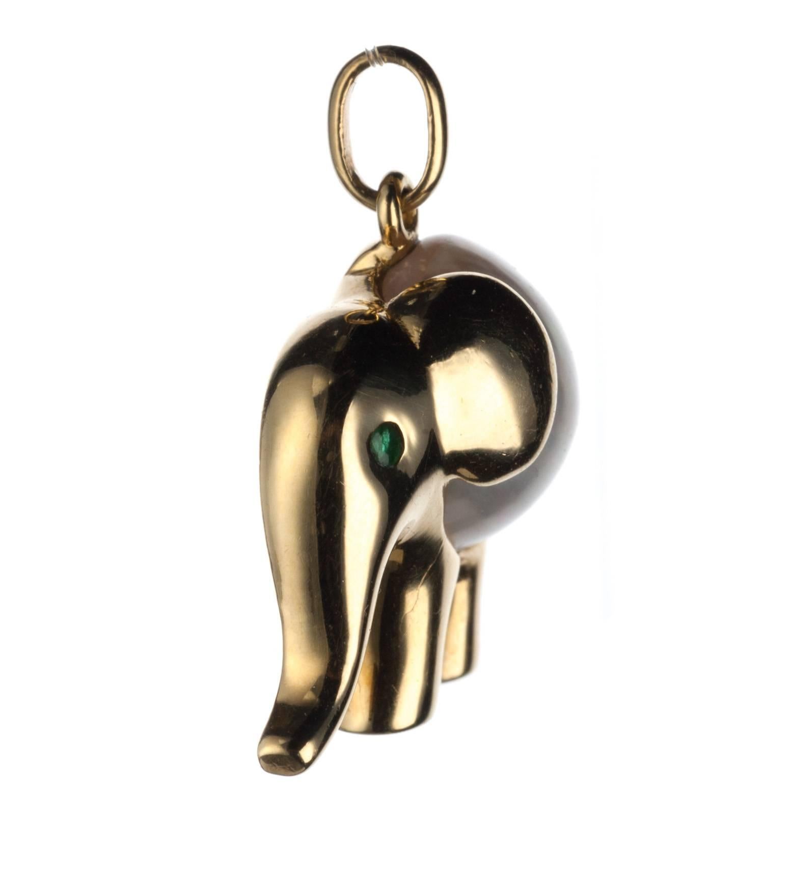 Adorable in its petite proportions, an elephant pendant from Parisian designer FRED. A cultured Mabe pearl makes up the elephant’s chubby body while the eye visible in profile is set with a single round emerald. Measures approx. 0.75” square.