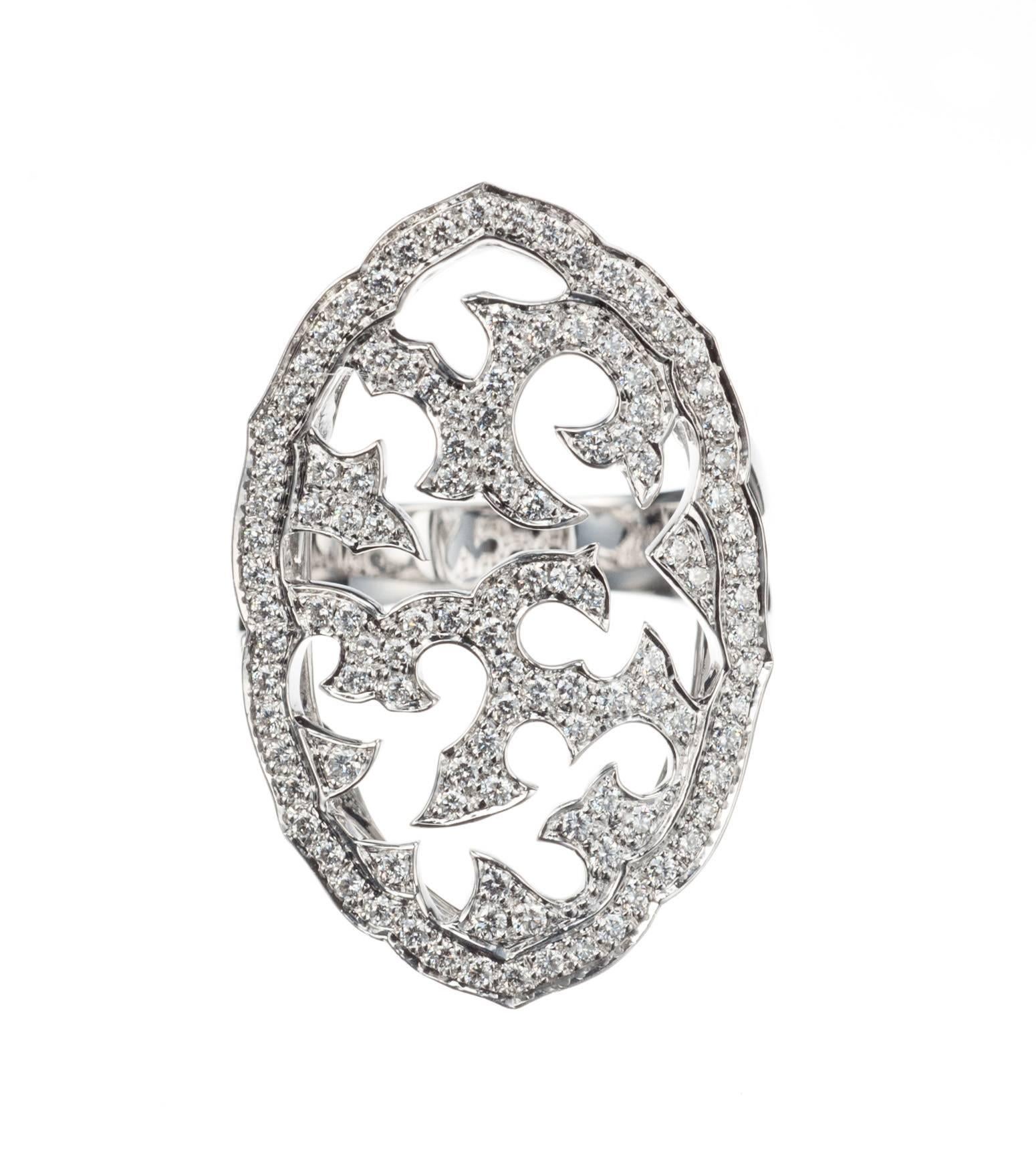 A dramatic oval panel of openwork is set throughout with 63 brilliant-cut round diamonds, .77ctw. of G-H color and SI clarity, on Stephen Webster’s 18-karat white gold “Borneo” ring.  Size 7; can be resized.